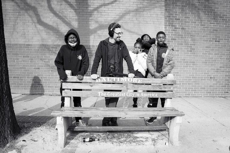 Aaron Henkin of WYPR with interviewees Tayvon, Tery, Avery and a friend near Fells Point on January 11, 2022.