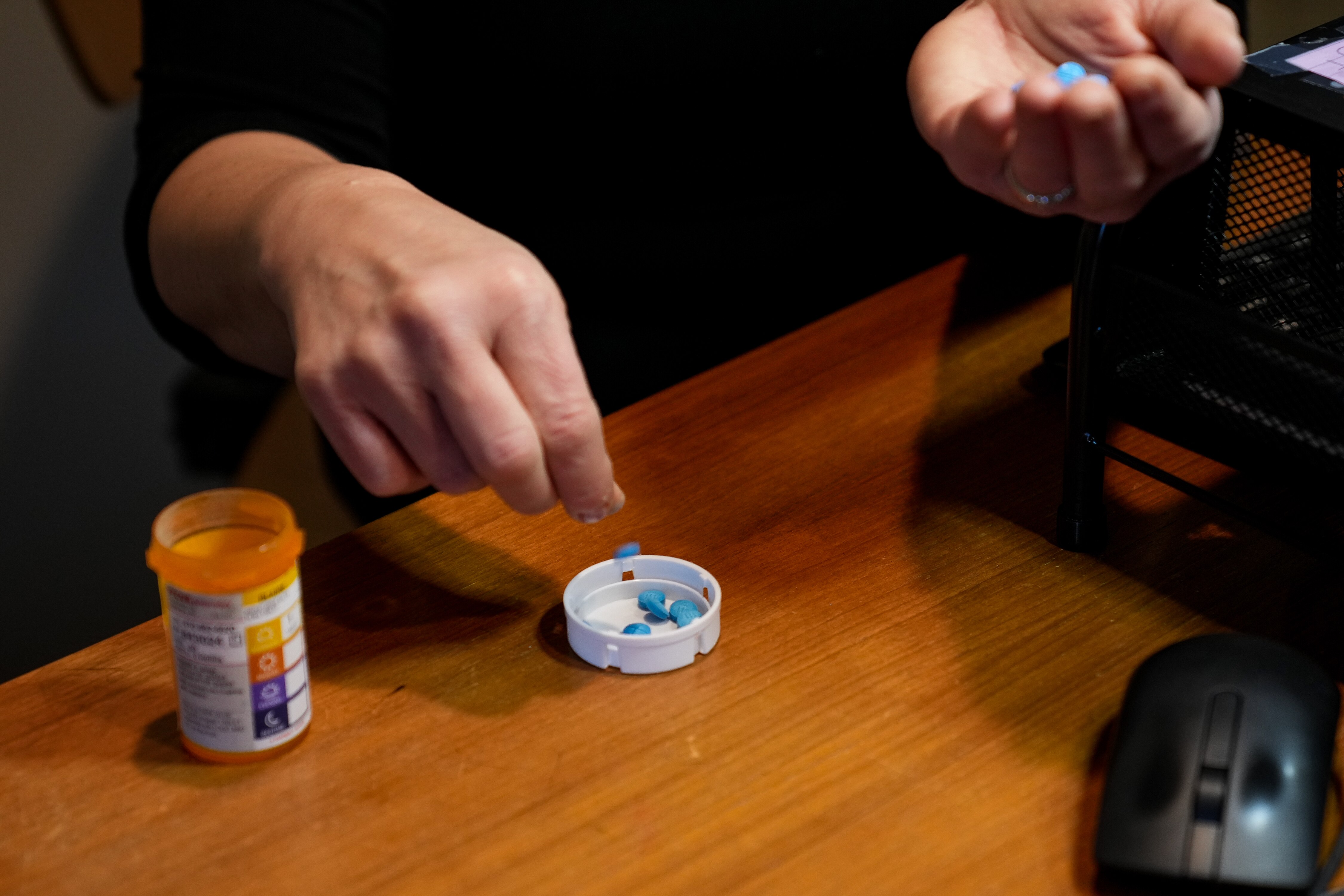 Blaire Postman, a Baltimore city resident who suffers from ADHD, demonstrates at her home how she has to ration her medication due to the possible unaffordablility or unavailablility of her meds in Baltimore City, Md. on February  12, 2023.