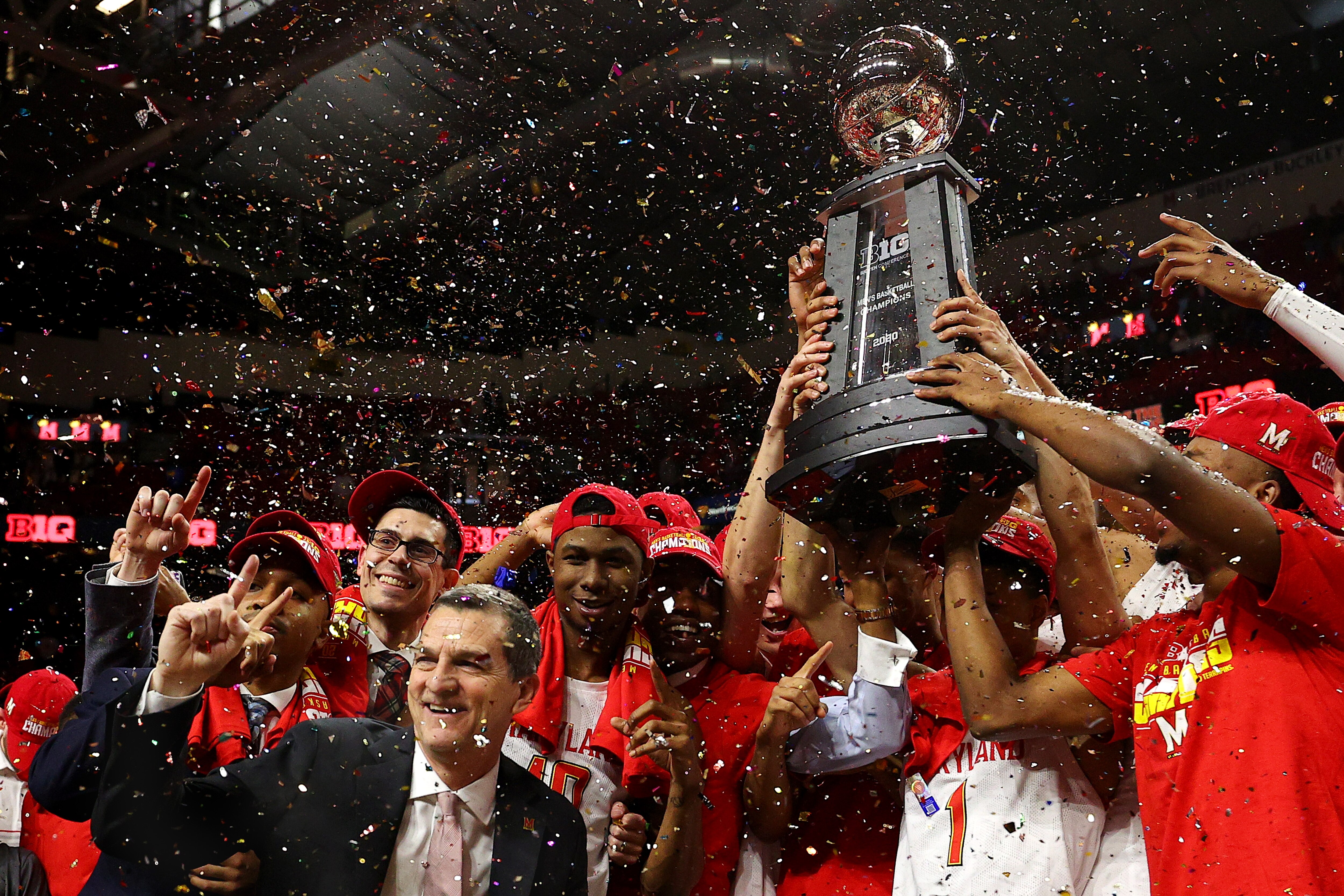 Mark Turgeon celebrates with Maryland players after beating Michigan 83-70 to clinch a share of the Big Ten regular-season title in 2020.