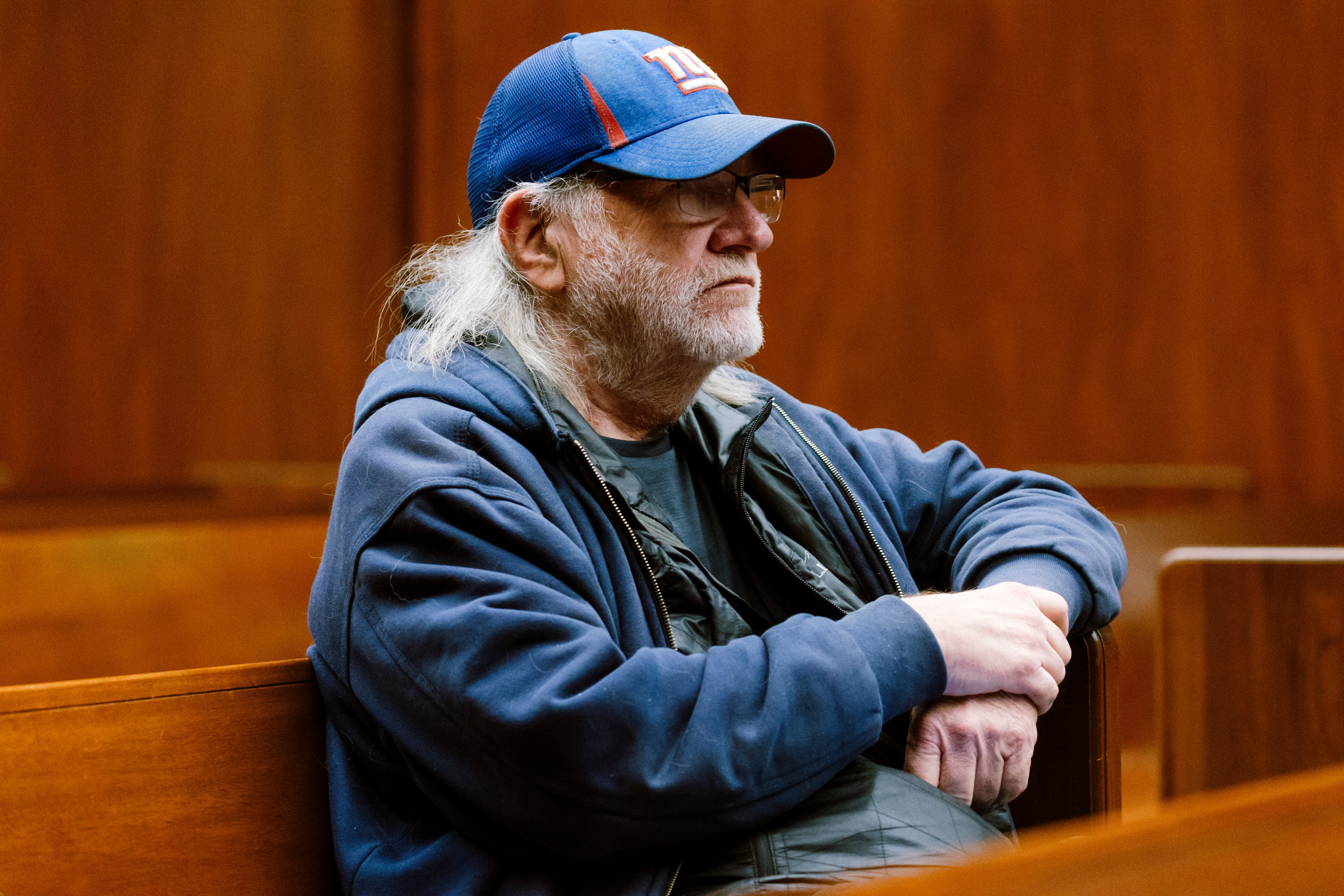 Fred Homan, a former county administrative officer, reviews documents before addressing the Baltimore County Council during a legislative session in Towson in September.