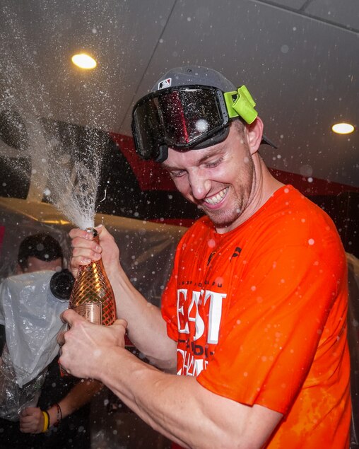 Baltimore Orioles second baseman Jordan Westburg pops champagne in the locker room after clinching the AL East division on Thursday, September 28, 2023. The beat the Boston Red Sox, 2-0, to secure control of the division.