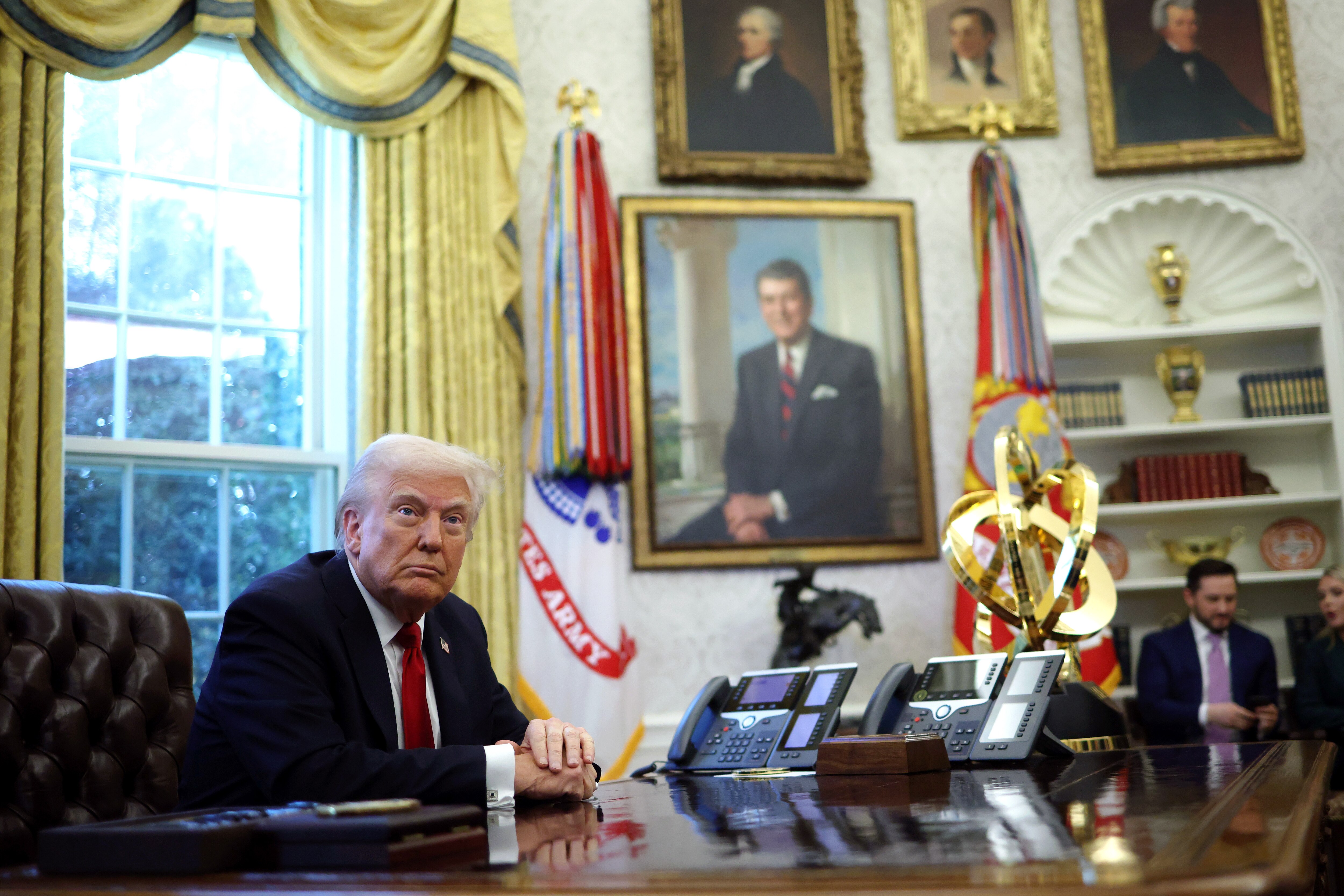 WASHINGTON, DC - MARCH 26: U.S. President Donald Trump prepares to sign an executive order in the Oval Office of the White House on March 26, 2025 in Washington, DC. President Trump is expected to announce automobile tariffs on foreign-made cars.