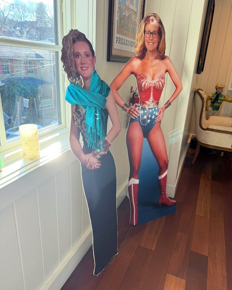 The "OG Cardboard Kate" and the Wonder Woman Cardboard Kate at the celebration following her funeral, Dec 20, 2025. Katie said she wanted a party and didn't want everyone being sad.