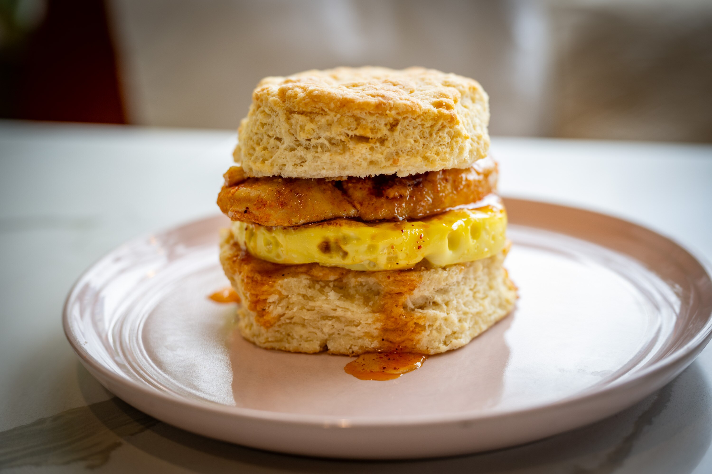 Nana’s Famous Biscuits at Rize + Rest cafe includes one with marinated chicken breast, egg and chili honey.