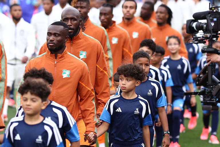 Members of the DCFC U10 boy’s team accompany Cote D’Ivoire onto the field ahead of its Group A World Cup fixture against Ecuador. The club was one of 32 local community partners selected by Common Goal to participate in World walkouts.