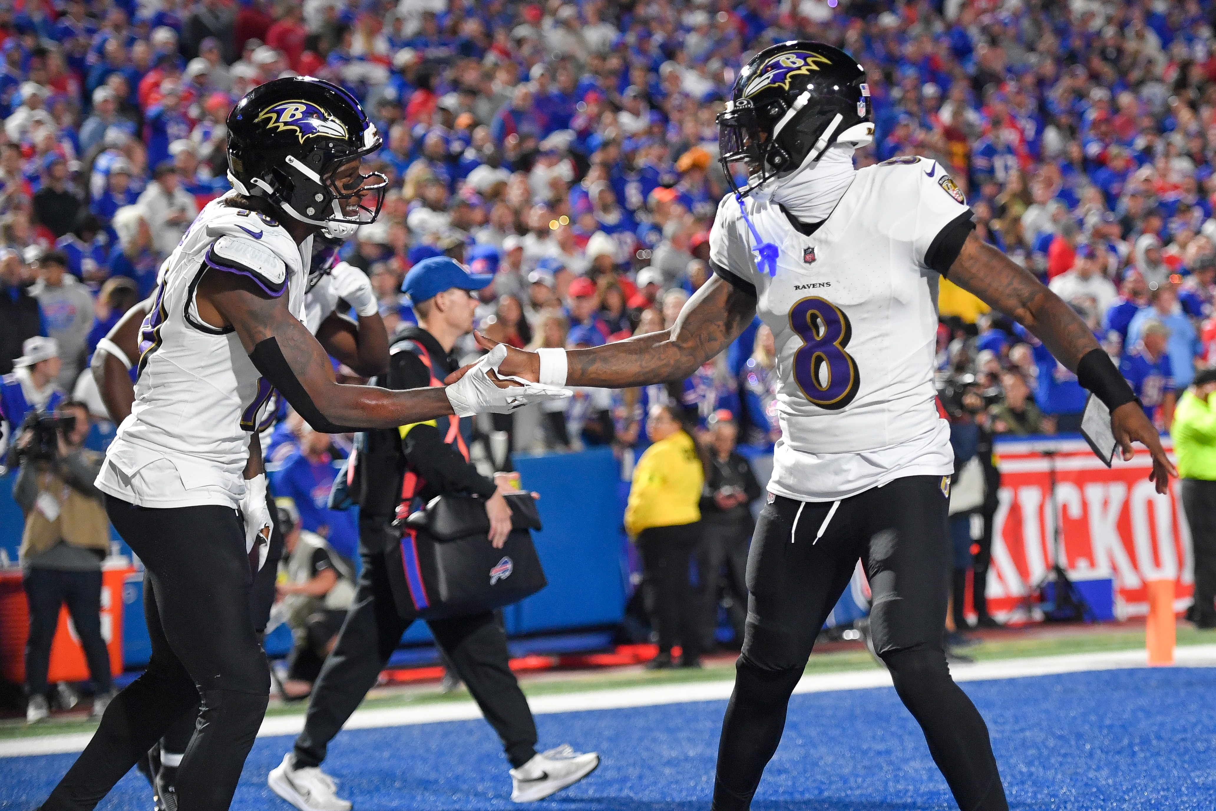 Ravens wide receiver DeAndre Hopkins, left, celebrates with quarterback Lamar Jackson after scoring during the second half against the Buffalo Bills.