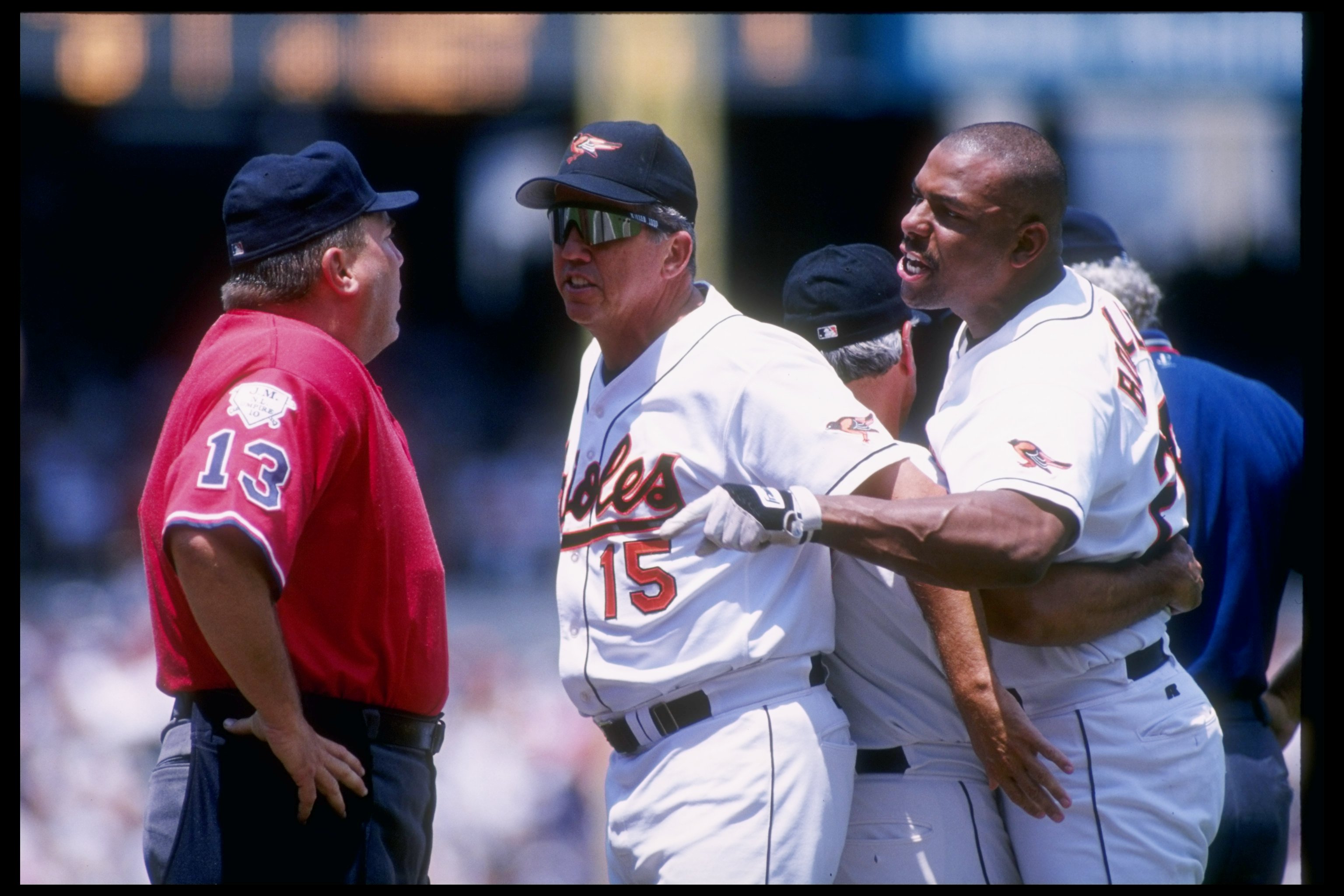 Outfielder Bobby Bonilla of the Baltimore Orioles, right, and manager Davey Johnson during a confrontation with the umpire in a game against the the Boston Red Sox in 1996. The Orioles won the game 4-3.