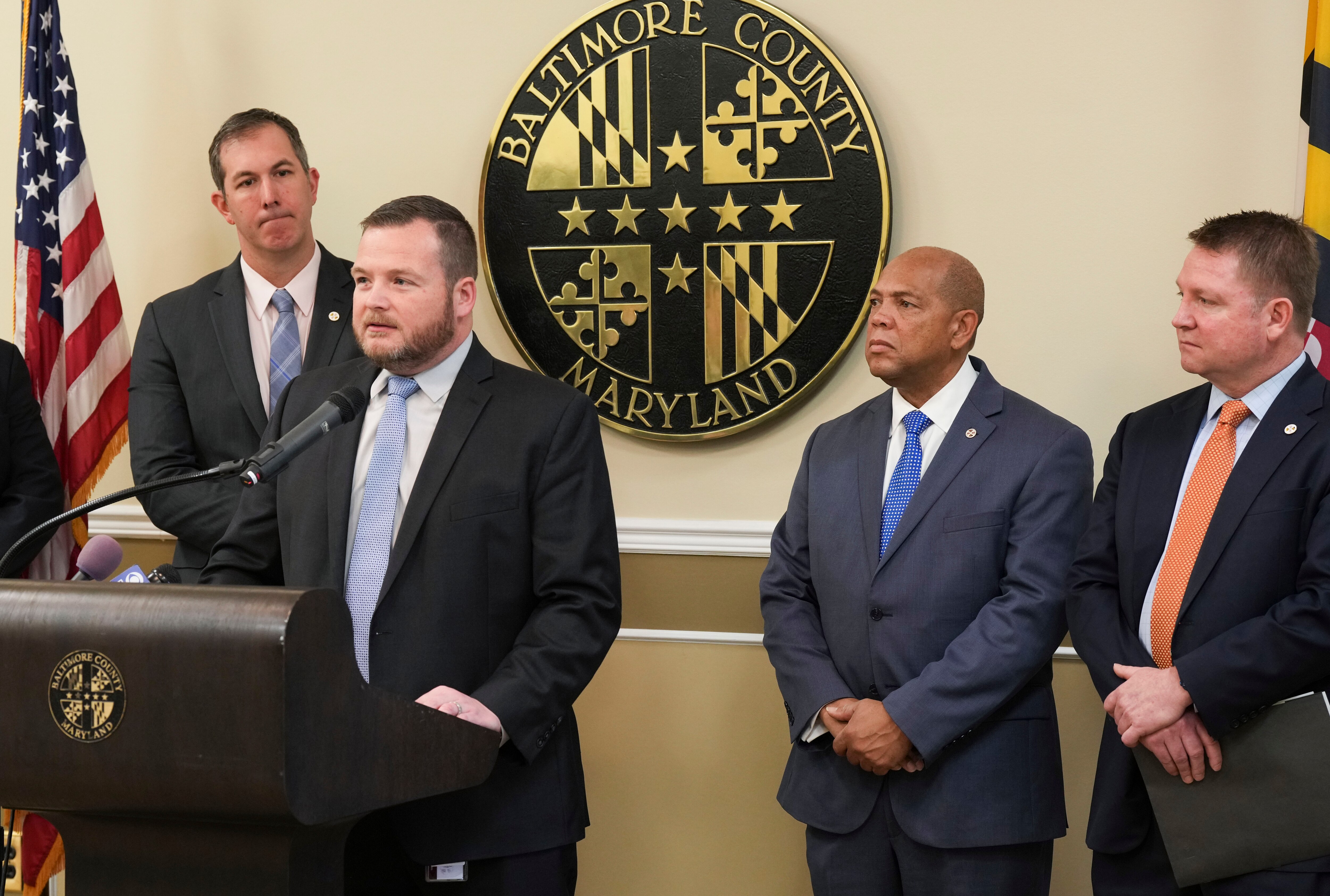 Johnny Olszewski, Pat Young, Julian Jones, and Terry Hickey speak at a press conference announcing a package of foundational legislative reforms to expand access to new housing opportunities as well as address community concerns in Baltimore County.