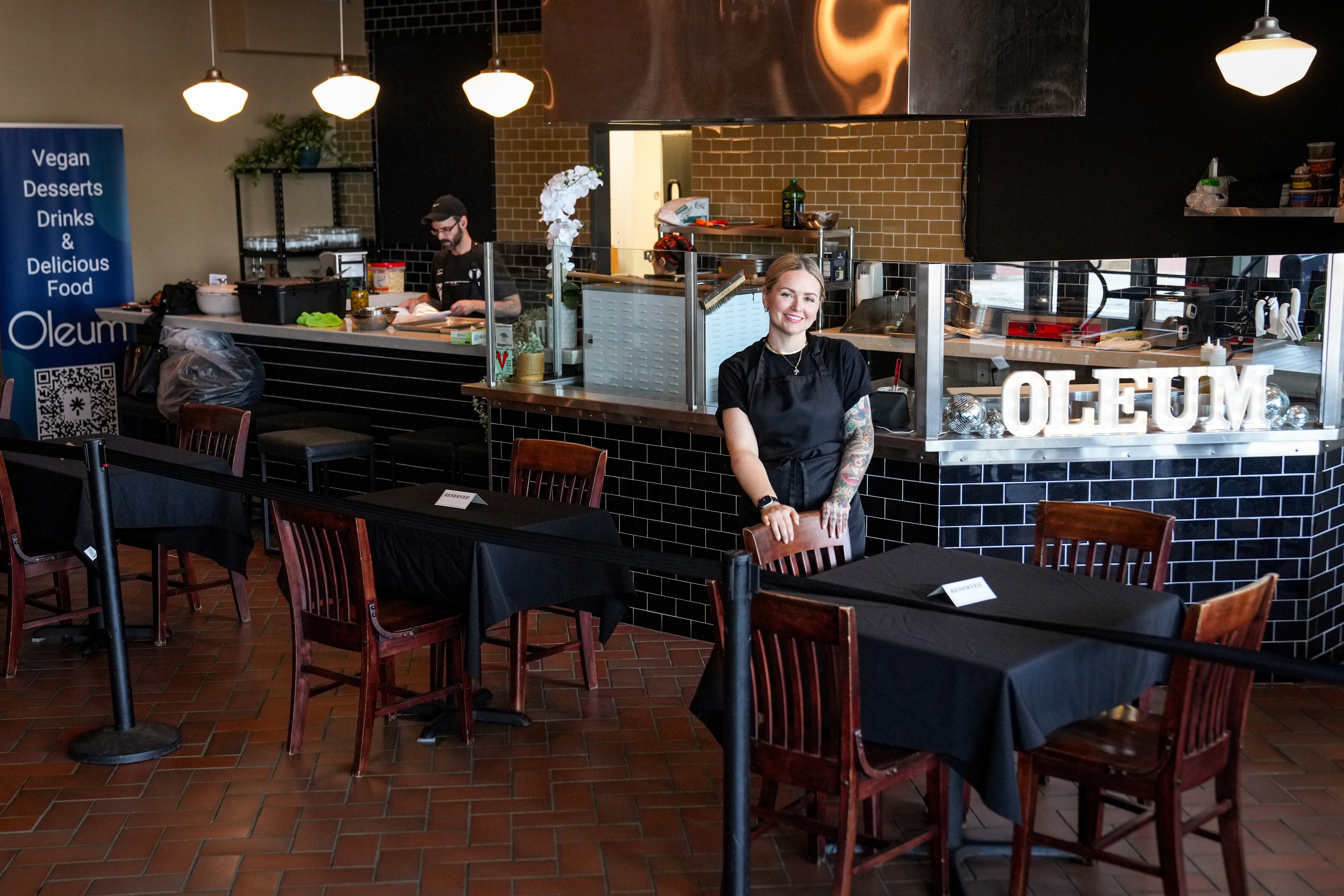 Alisha Adibe, head chef and owner of Oleum, shows off her new location at Harborplace.