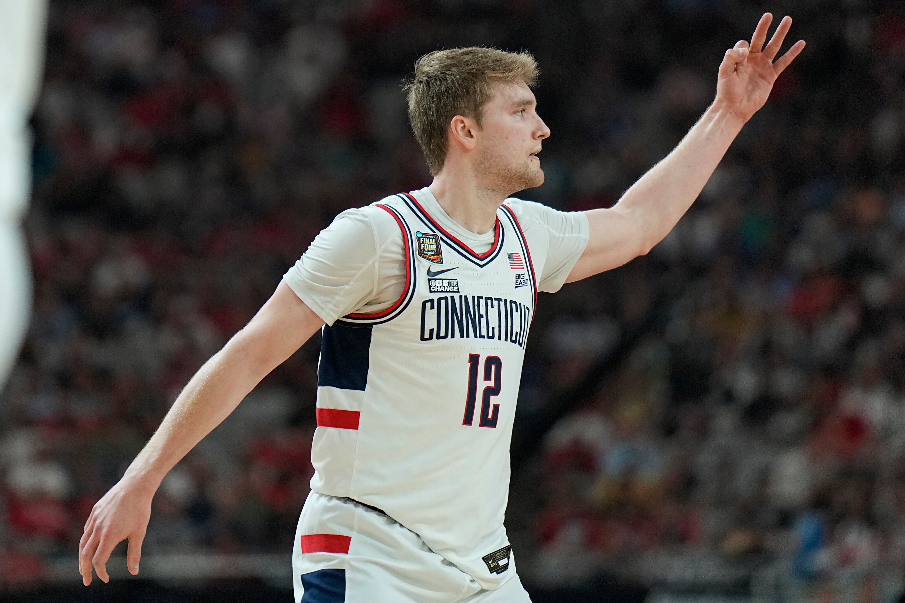 UConn guard Cam Spencer celebrates a three pointer against Alabama during the first half of the NCAA college basketball game at the Final Four, Saturday, April 6, 2024, in Glendale, Ariz. (AP Photo/Brynn Anderson )