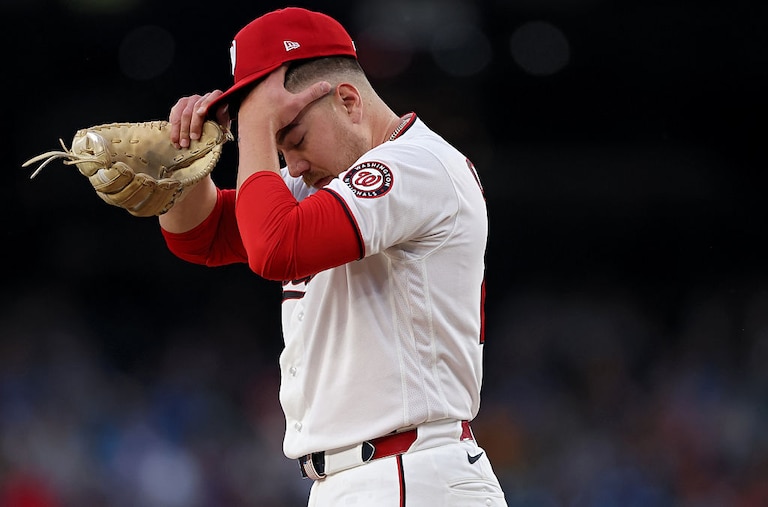Washington Nationals starting pitcher Cade Cavalli reacts during the fourth inning against the Minnesota Twins.