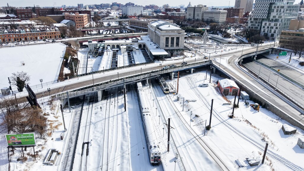 Aerial view of snow-covered train tracks at Penn Station in Baltimore, Md., on Monday, January 26, 2026.