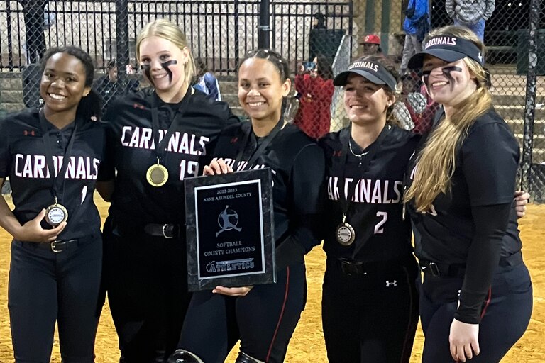 Crofton softball captains pose with the Anne Arundel County championship plaque. The No. 3 Cardinals won their first title with a 10-1 victory over Northeast at Bachman Park.