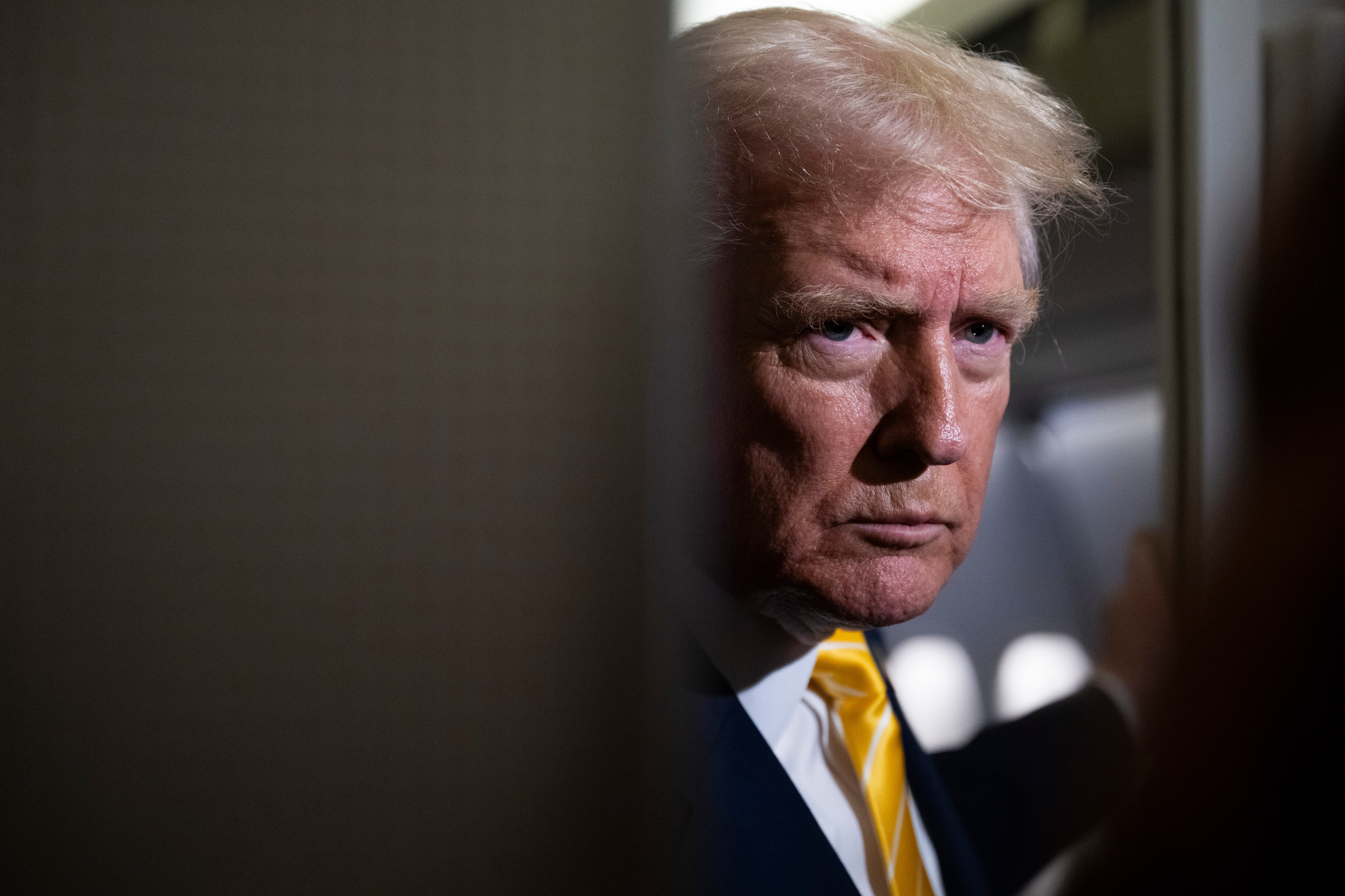 IN FLIGHT - NOVEMBER 14: U.S. President Donald Trump speaks to members of press aboard Air Force One on November 14, 2025 while in flight from Washington, DC to West Palm Beach International Airport. Trump is scheduled to spend the weekend at his Mar-A-Lago estate in Palm Beach, Florida. (Photo by Roberto Schmidt/Getty Images)