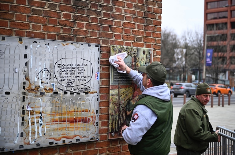 Panels that were part of an exhibit on slavery at the President's House Site in Philadelphia are put back Thursday, Feb. 19, 2026.