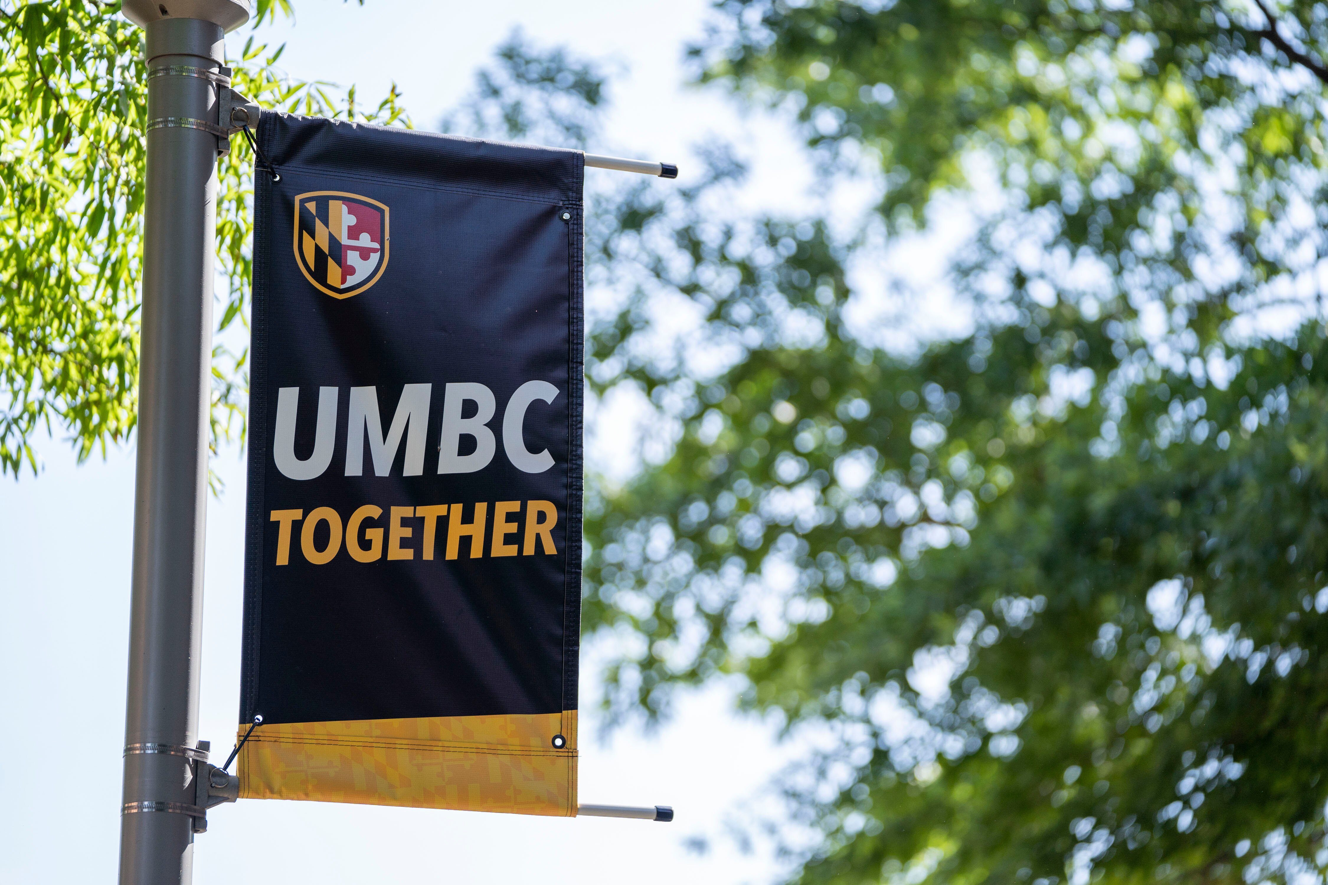 A pole banner on UMBC campus near the Retriever Activities Center.