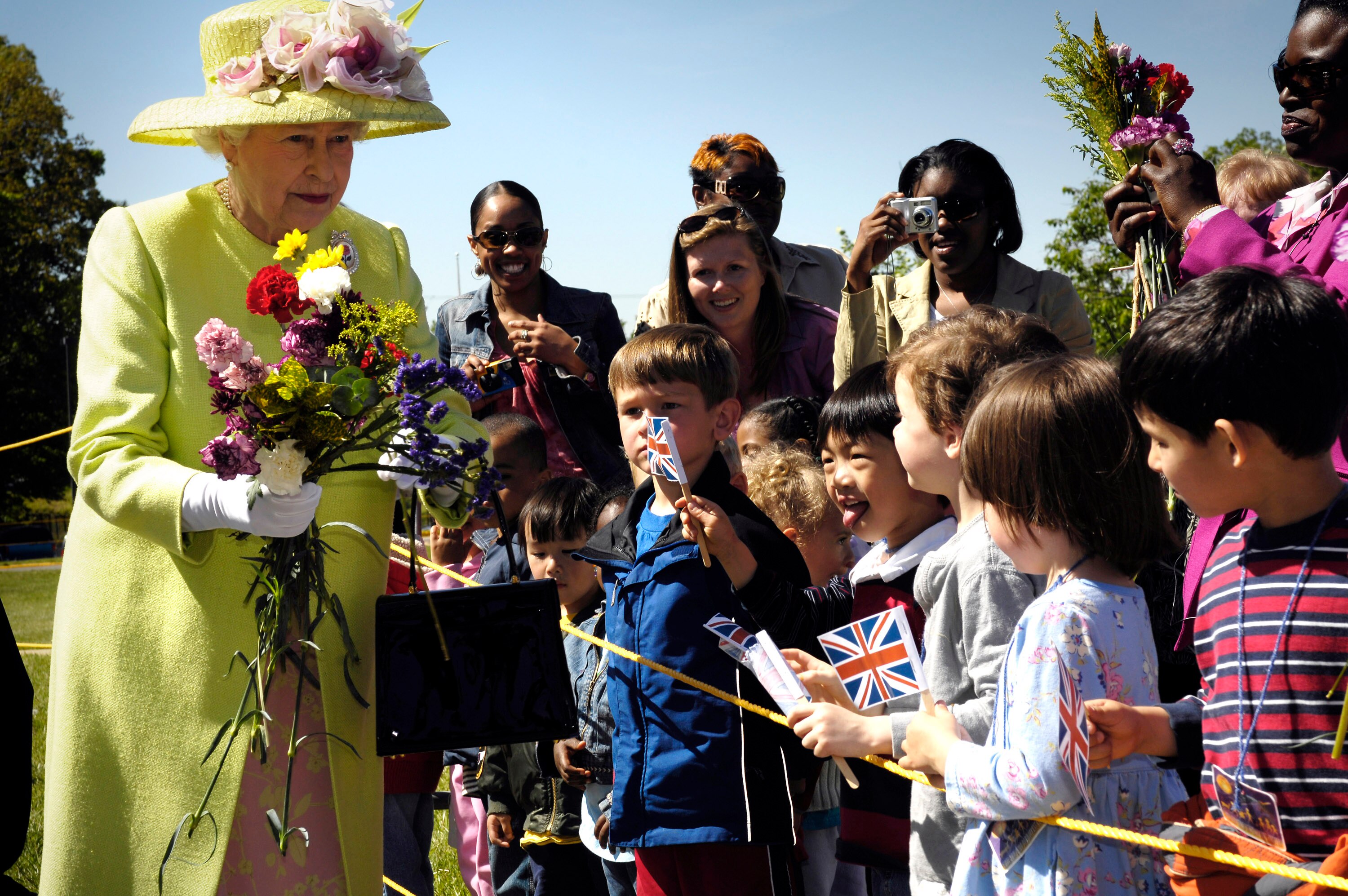 HM Queen Elizabeth II is greeted by children on her walk from NASA’s Goddard Space Flight Center mission control to a reception in the center’s main auditorium May 8, 2007 in Greenbelt, Maryland. The queen is on the last of a six-day visit to the U.S with her husband, Prince Philip, the Duke of Edinburgh.