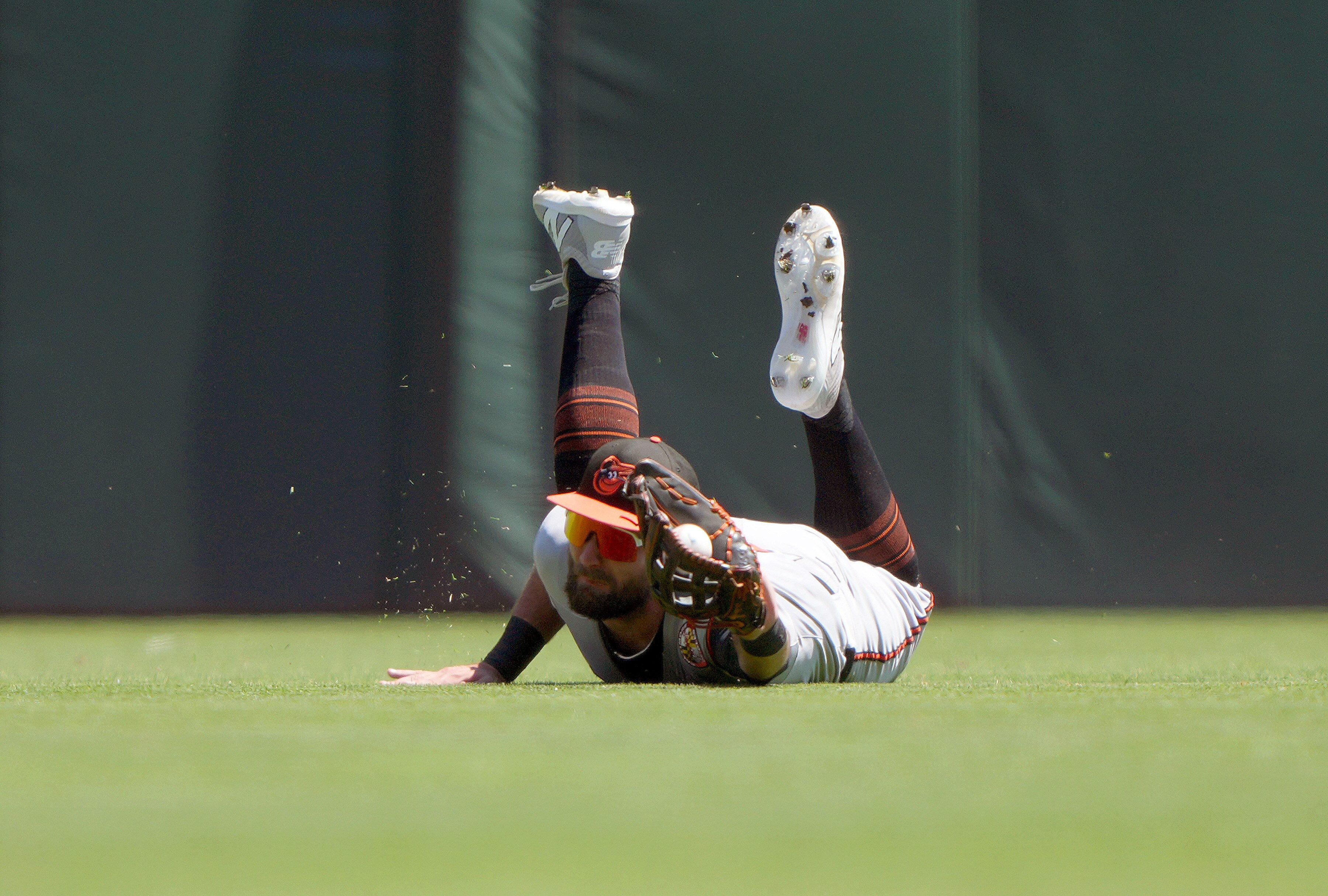 Orioles center fielder Colton Cowser takes a hit away from Heliot Ramos of the Giants with a diving catch in the first inning.