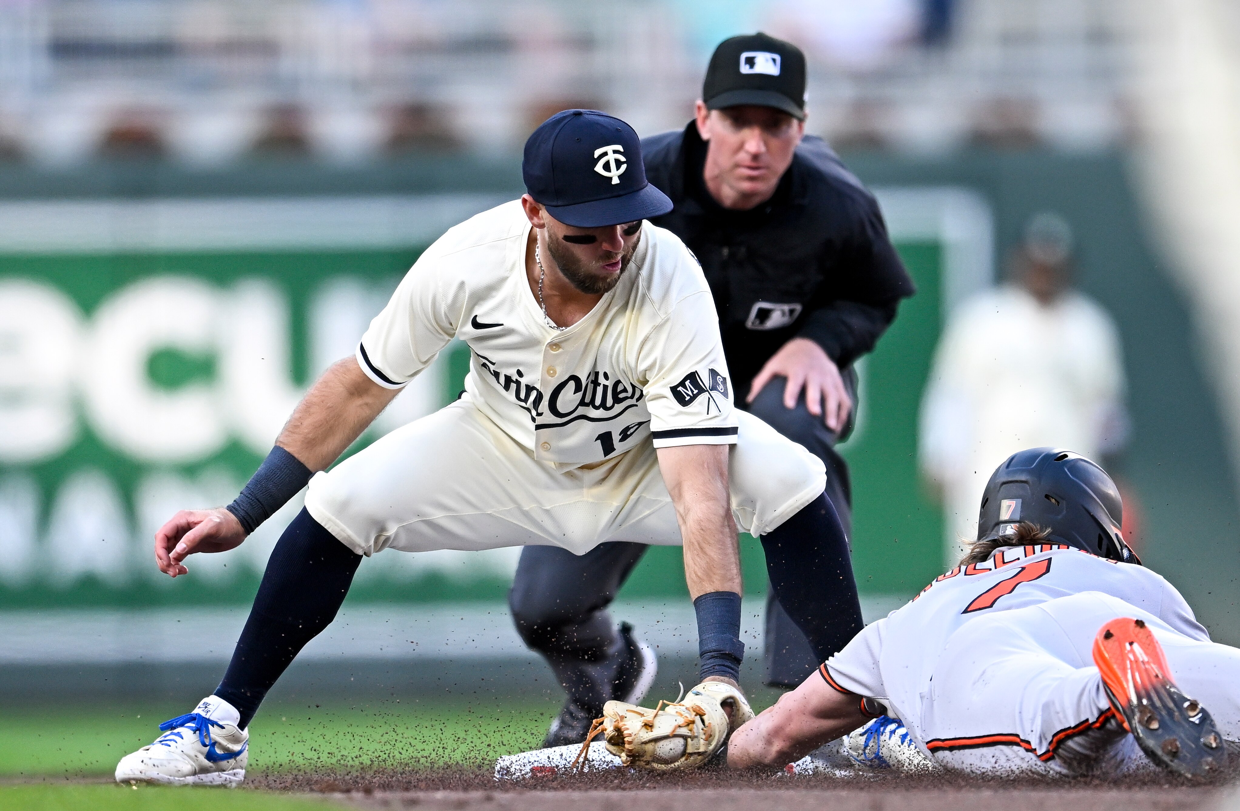 Kody Clemens of the Twins tags out Jackson Holliday for a caught stealing in the second inning Wednesday night in Minneapolis.