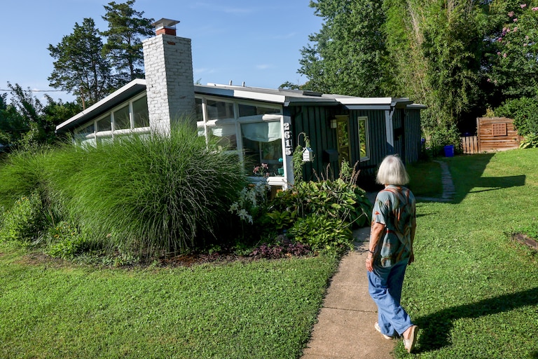 Marina Sefcik Callahan walks up to her Charles Goodman designed home ahead of a planned 75th anniversary celebration of Goodman houses found in the Wheaton Crest neighborhood of Silver Spring.