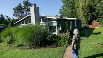 Marina Sefcik Callahan walks up to her Charles Goodman designed home ahead of a planned 75th anniversary celebration of Goodman houses found in the Wheaton Crest neighborhood of Silver Spring.
