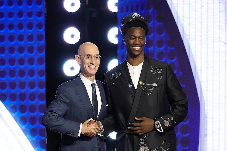 NBA commissioner Adam Silver shakes hands with AJ Dybantsa after he is drafted first overall by the Washington Wizards.