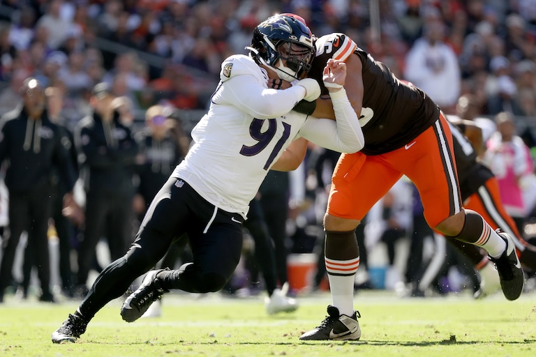 Ravens outside linebacker Trey Hendrickson (91) is blocked by Cleveland Browns offensive tackle Spencer Fano (55) last Sunday.