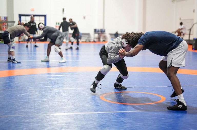 Eugene Harney, second from right, spars with fellow student Aaron Turner as during wrestling practice at Hill Field House on Morgan State University’s campus in Baltimore, Md., on Monday, March 16, 2026.