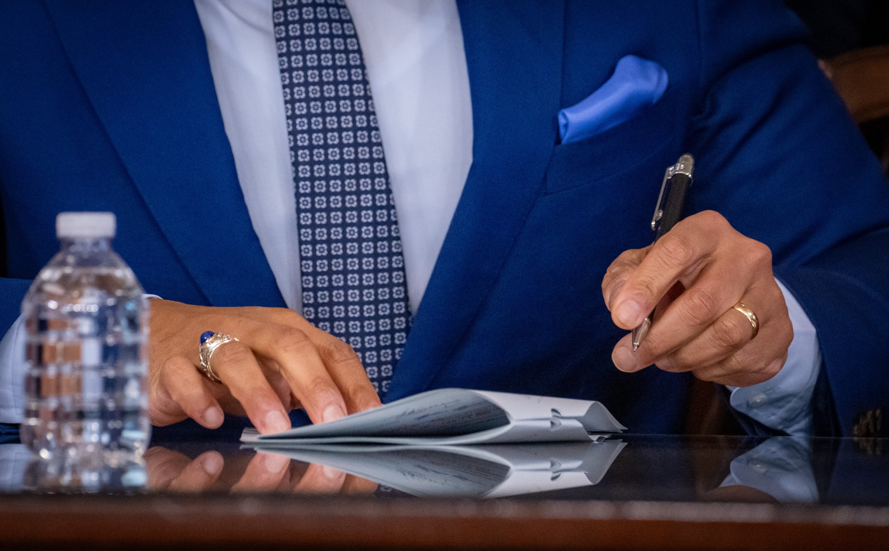 Maryland Governor Wes Moore signs a bill into law Tuesday at the State House.