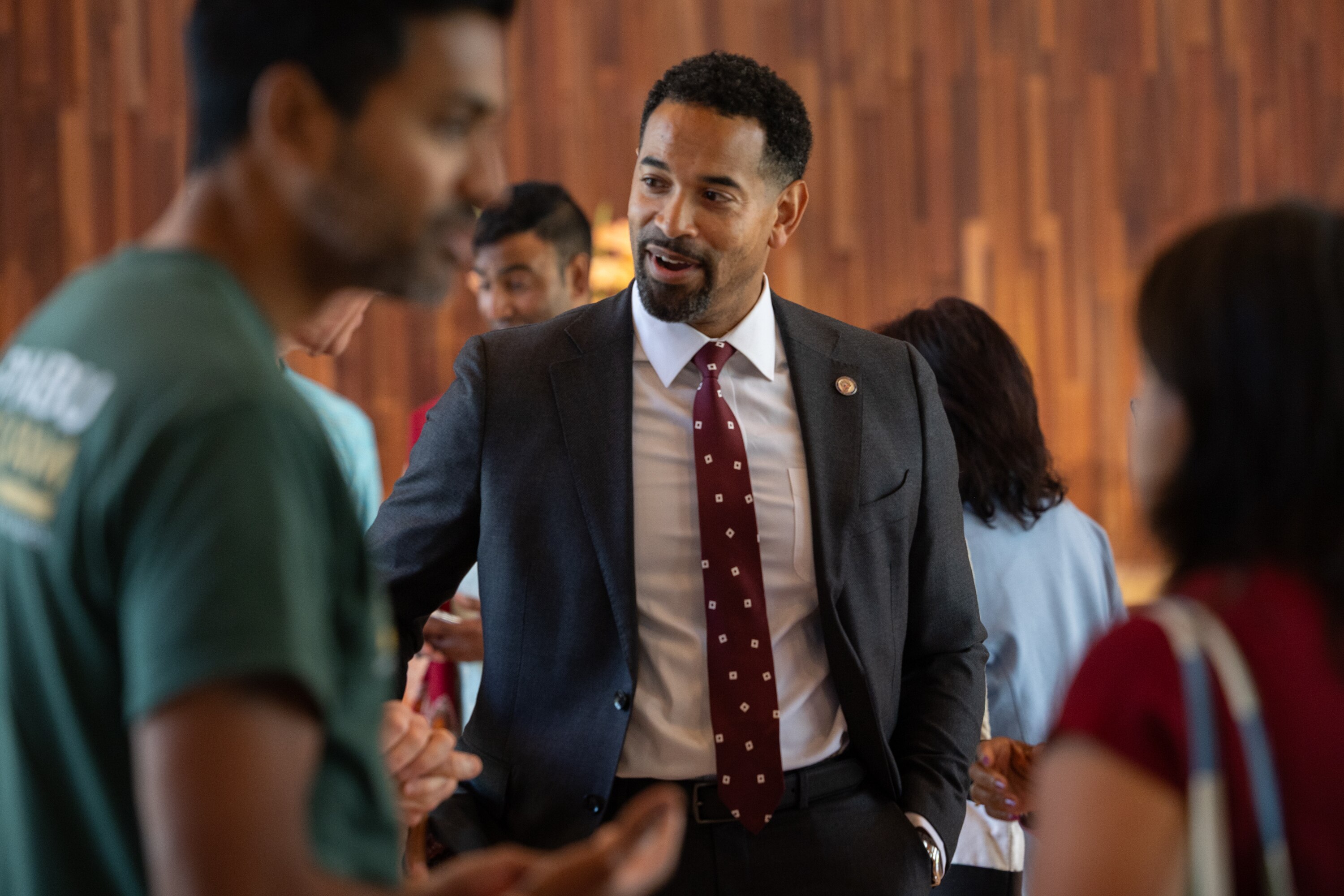 Will Jawando, one of three County Council members running for county executive in Montgomery County, meets attendees of a worship service at Cedar Lane in Bethesda.