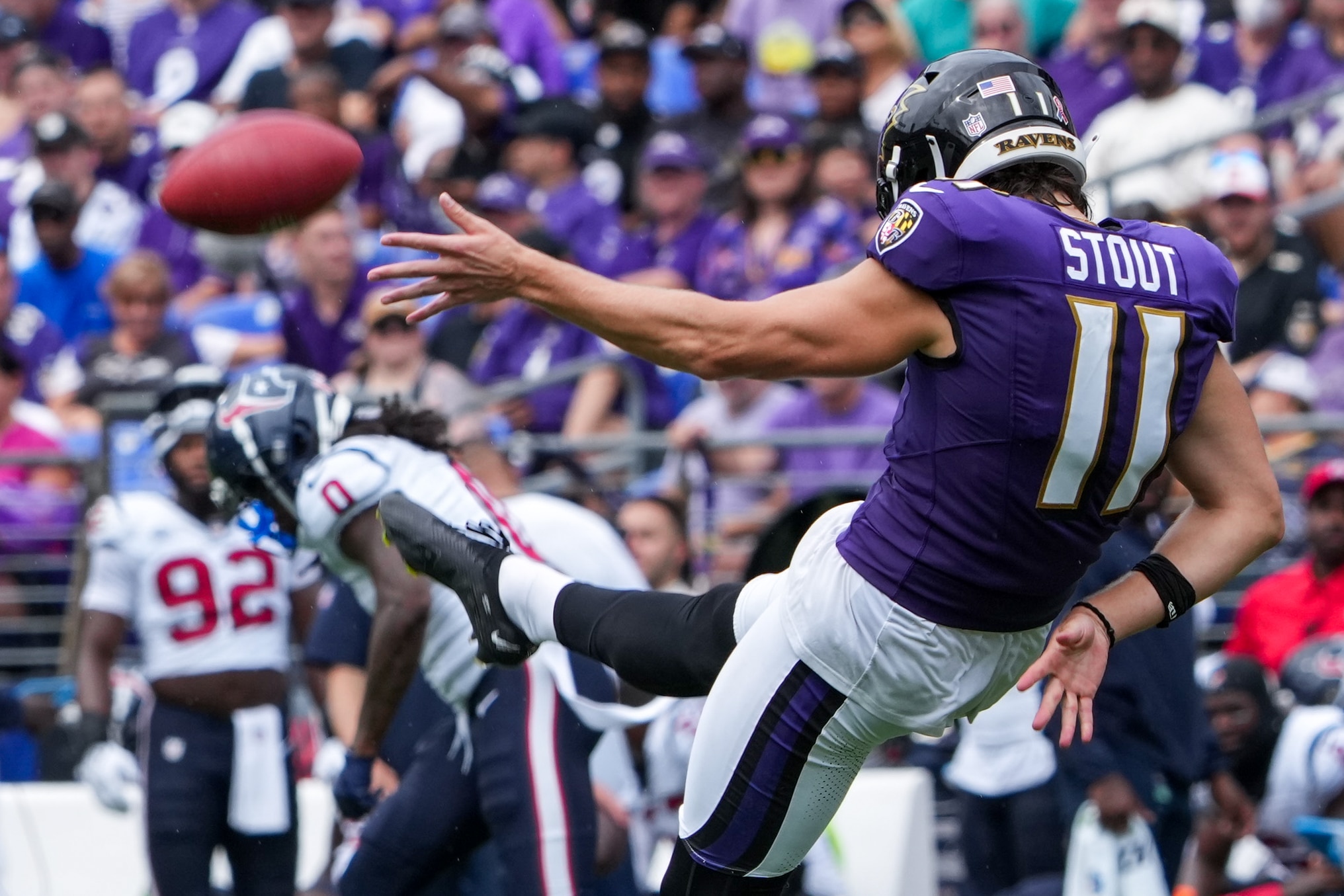 Baltimore Ravens punter Jordan Stout (11) punts down the field in the opening game of the season against the Houston Texans at M&T Bank Stadium on Sunday, September 10, 2023.