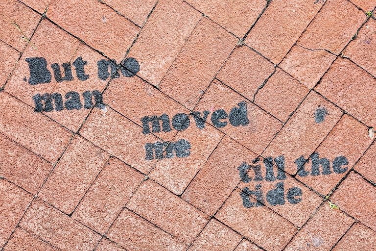 You can take your own force of nature to West Street, where someone stenciled the line, “But no man moved me till the tide,” onto the brick sidewalk and ask for a kiss.