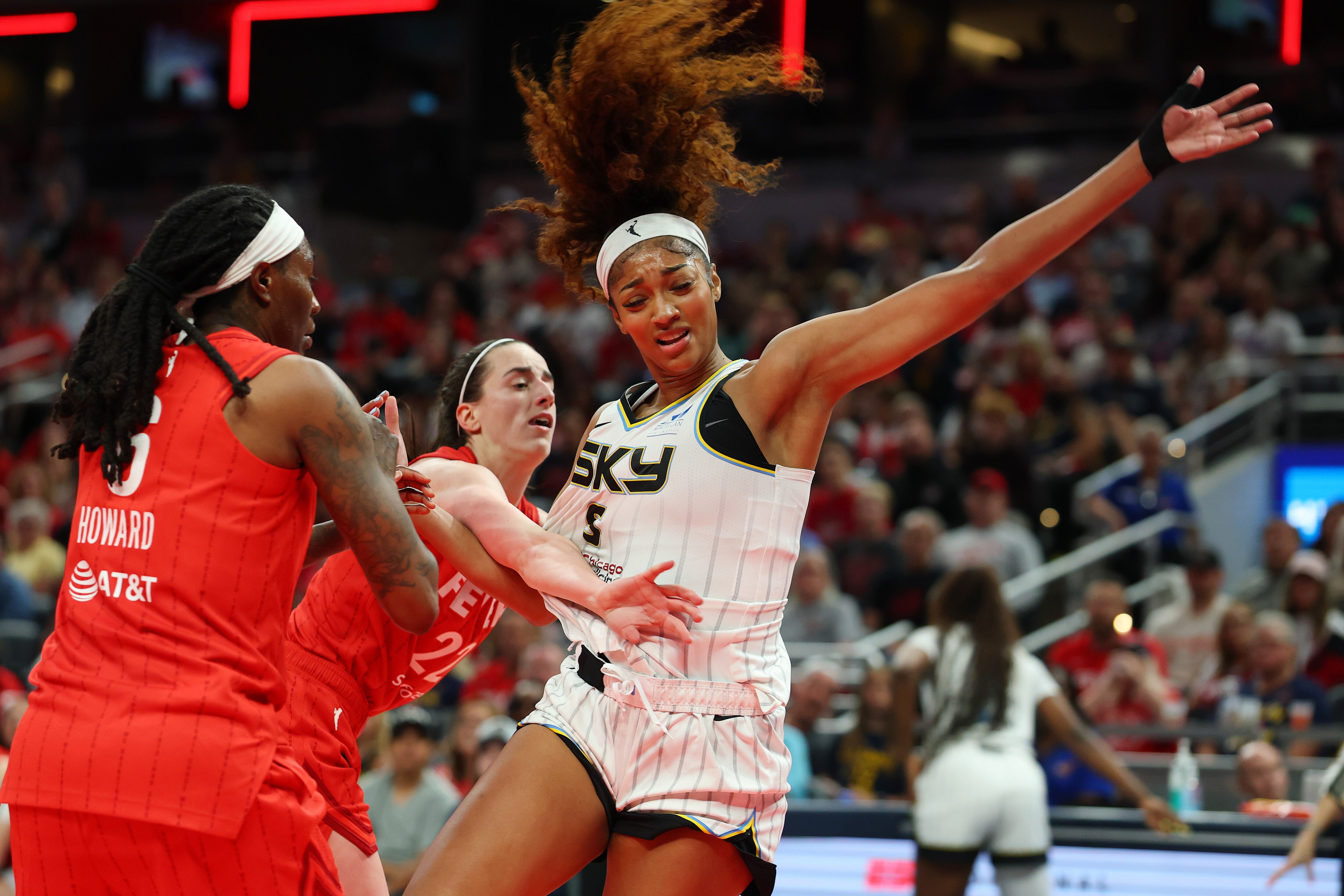 INDIANAPOLIS, INDIANA - MAY 17: Angel Reese #5 of the Chicago Sky takes a hard foul from Caitlin Clark #22 of the Indiana Fever in the second half during the Fever's home opener at Gainbridge Fieldhouse on May 17, 2025 in Indianapolis, Indiana.