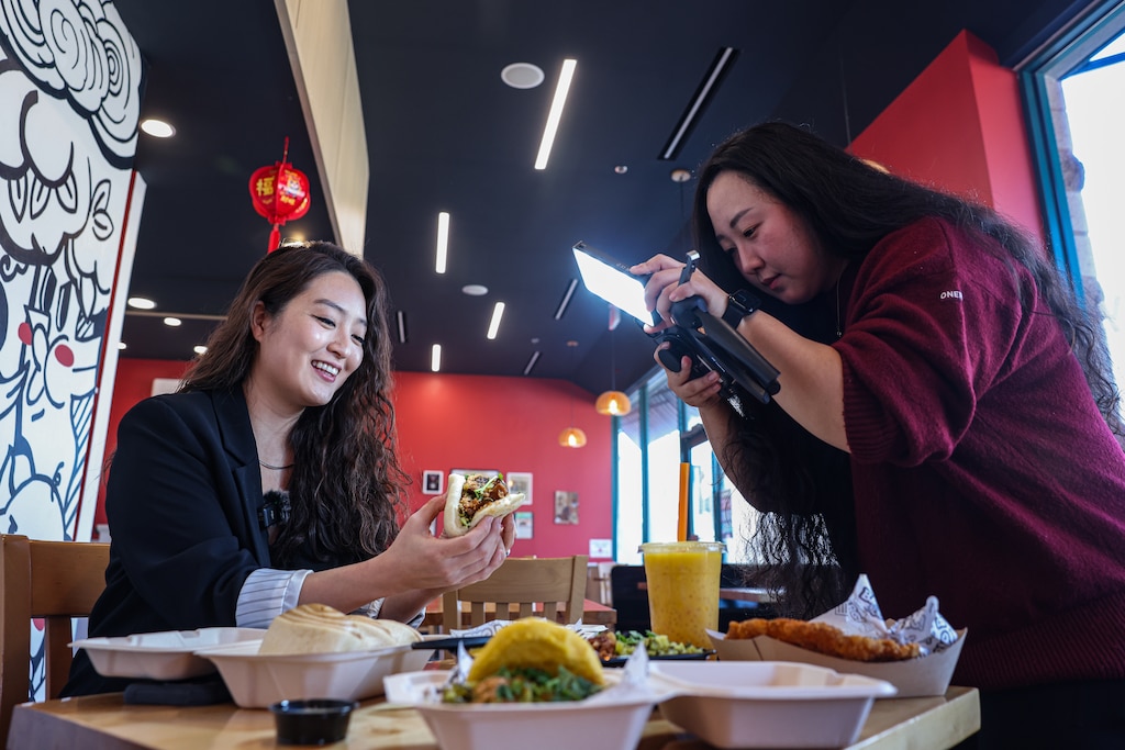 Kimberly Kong during filming of a new Instagram video profiling Bao Bei, a Taiwanese street food eatery in Rockville, Md. The restaurant is the 43rd stop in Kong’s series highlighting 100 Asian eateries on her social media platforms.