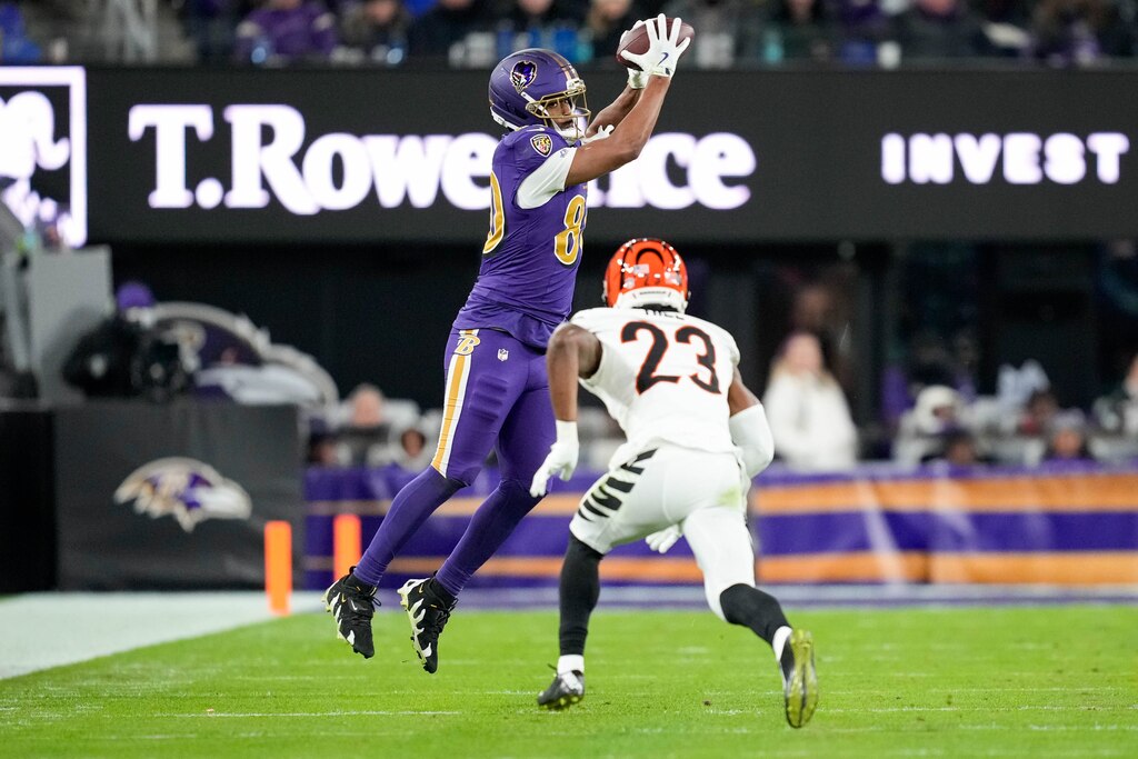 Baltimore Ravens tight end Isaiah Likely (80) leaps for a catch in the fourth quarter of a game against the Cincinnati Bengals on Thanksgiving at M&T Bank Stadium in Baltimore, Md., on Thursday, November 27, 2025.