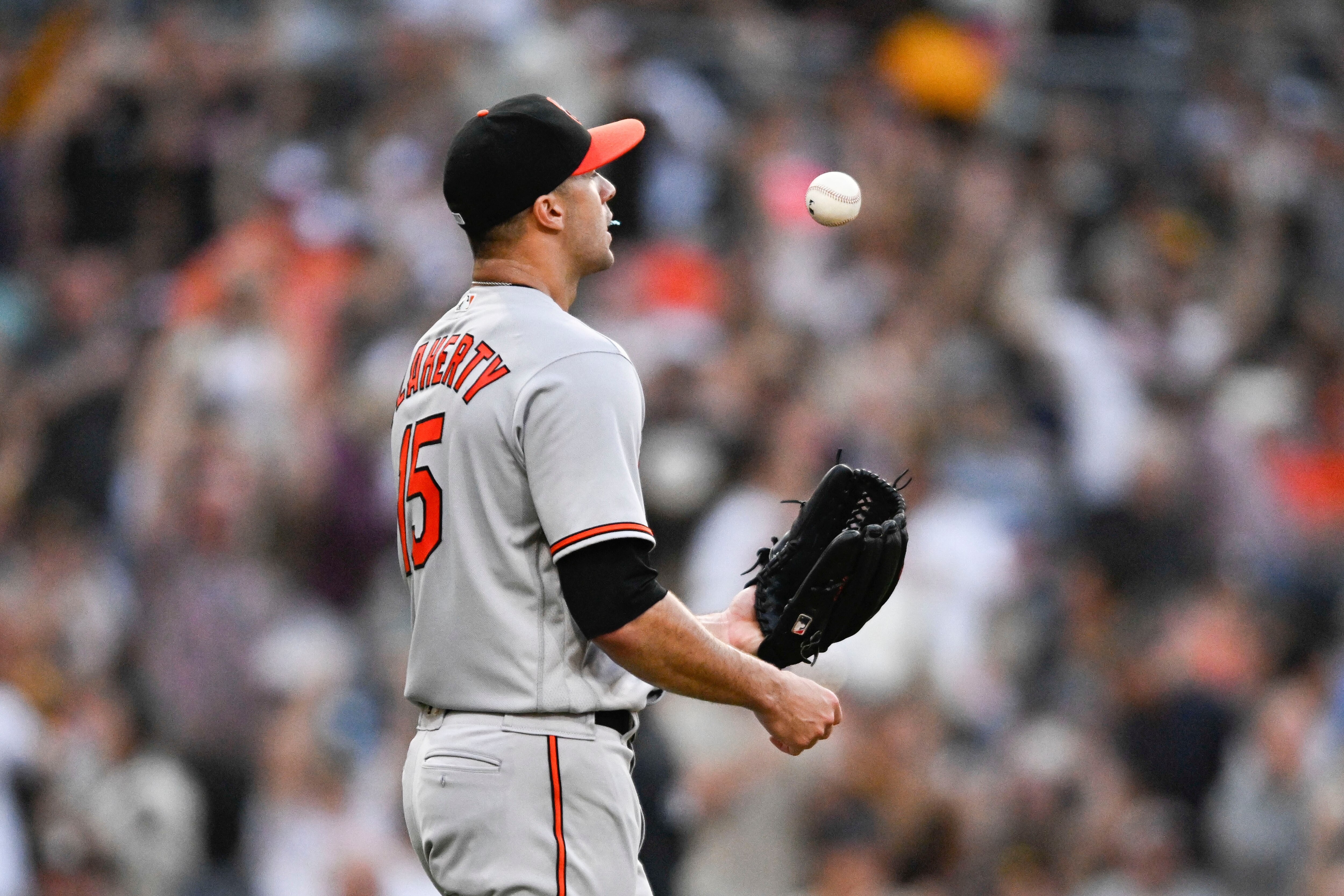 Jack Flaherty #15 of the Baltimore Orioles tosses the ball after giving up a grand slam home run to Gary Sanchez #99 of the San Diego Padres during the first inning of a baseball game on August 15, 2023 at Petco Park in San Diego, California.