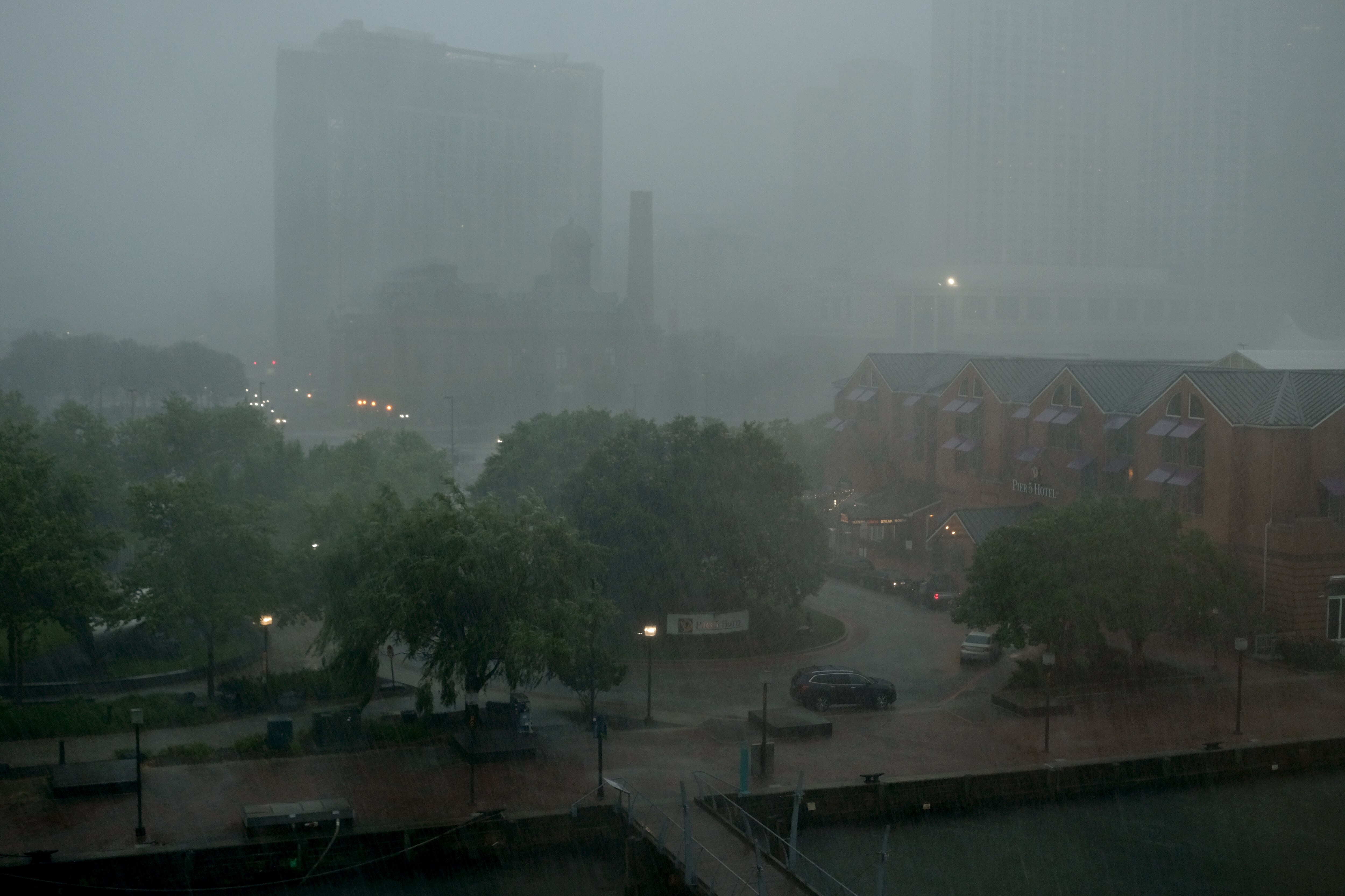 Rain pours as a storm rolls in downtown Baltimore on Tuesday, July 1, 2025.
