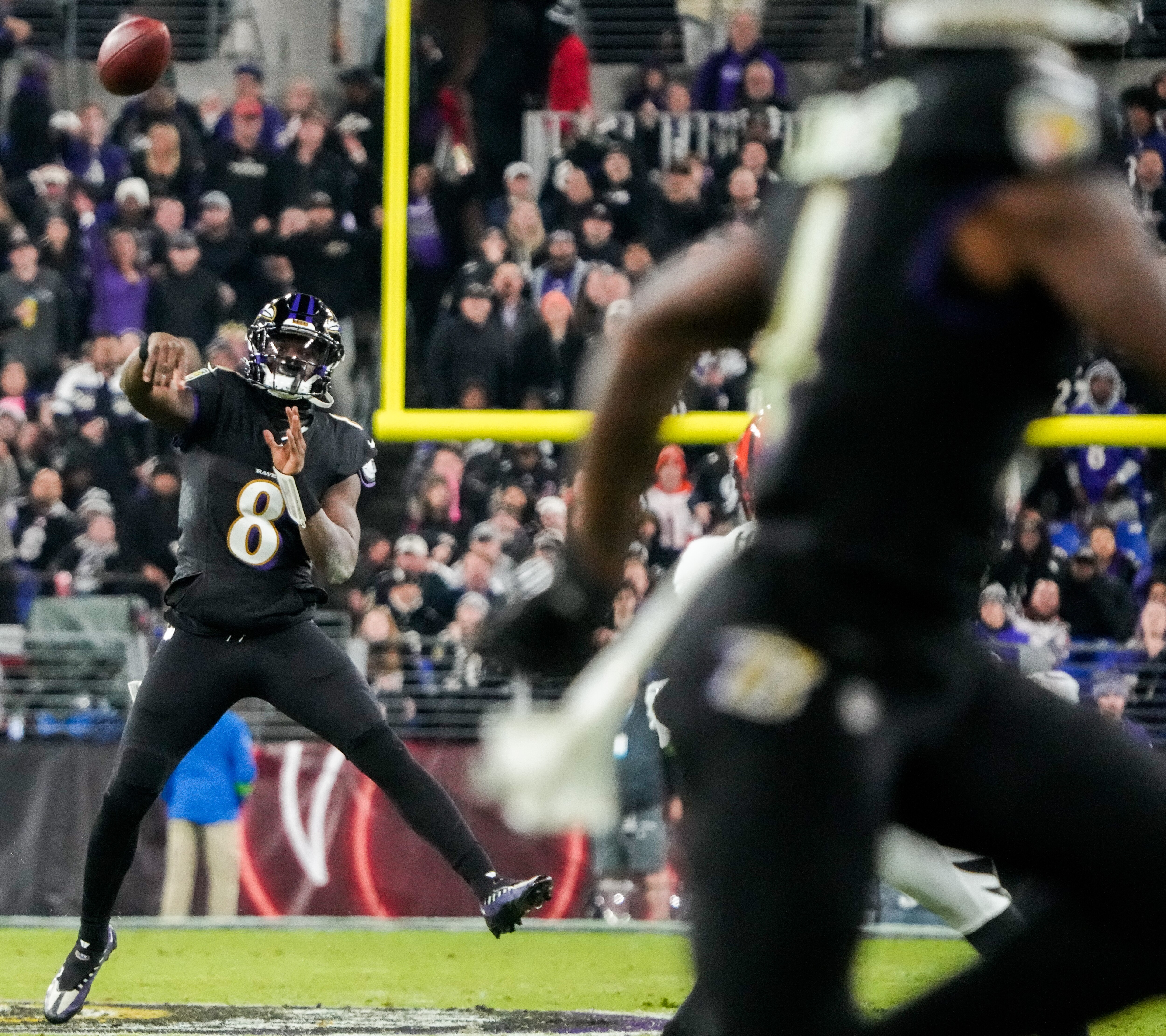 Ravens quarterback Lamar Jackson passes to wide receiver Zay Flowers during the third quarter Thursday night.