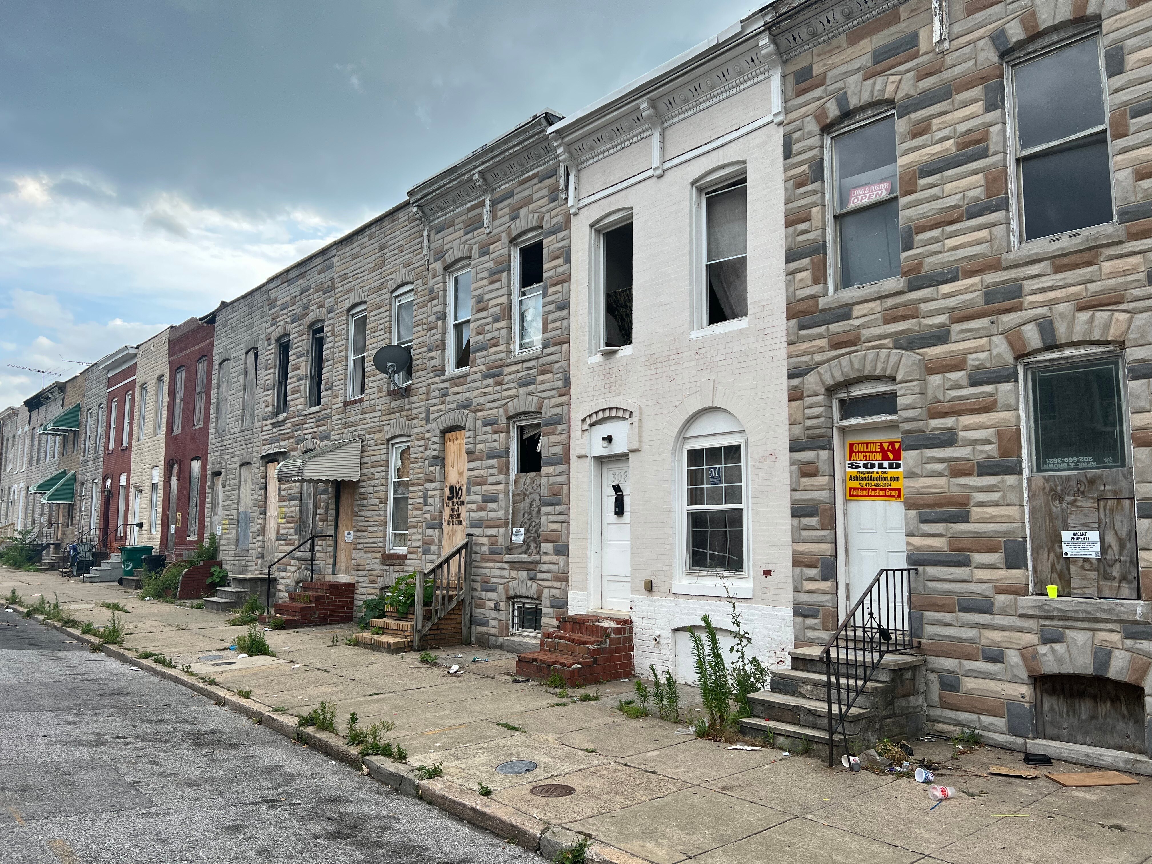 Out of 29 parcels on the even side of the 300 block of South Smallwood Street in Carrollton Ridge, 23 are officially listed as vacant, one is a vacant lot, and another not listed as vacant is, in fact, vacant.