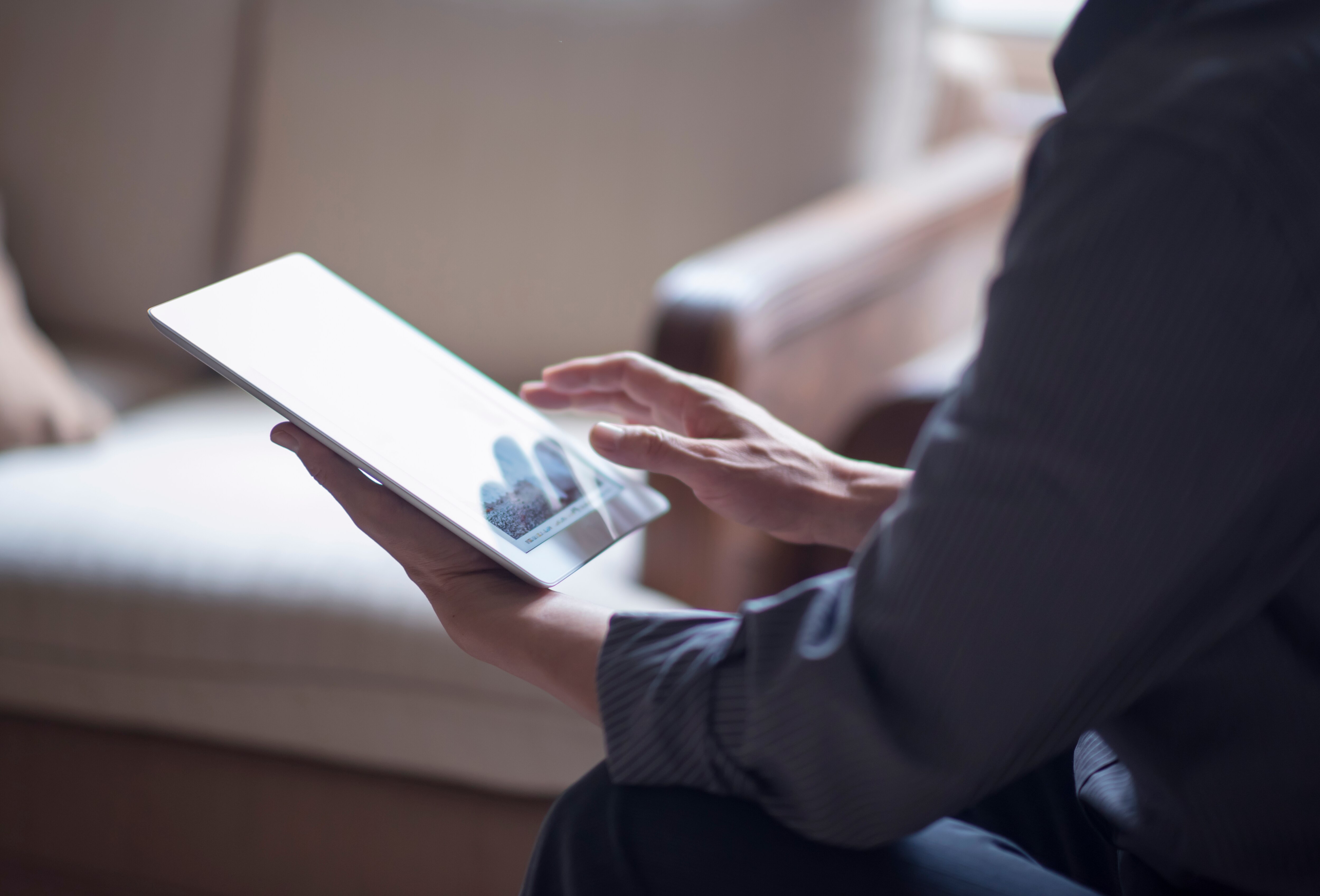 Reading digital stories off tablet.