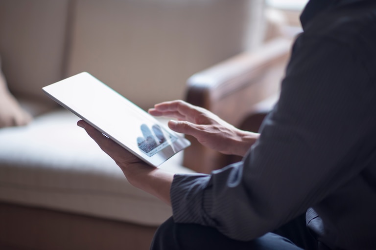 Reading digital stories off tablet.