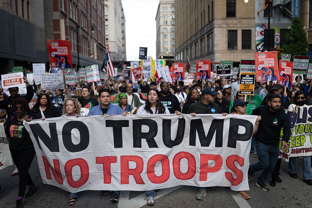 Demonstrators march through downtown during a protest against President Donald Trump's immigration policies on September 06, 2025 in Chicago, Illinois.