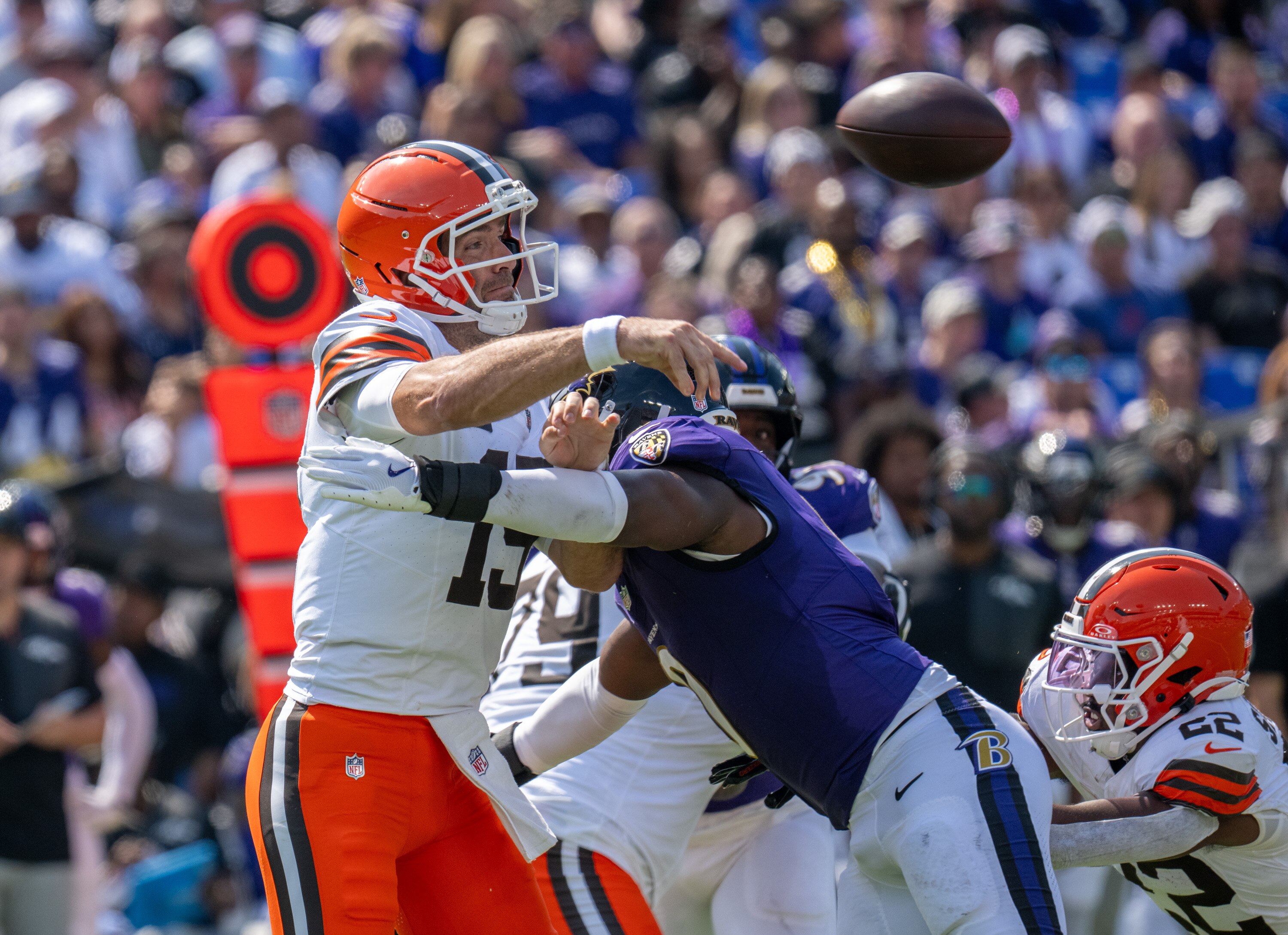 Ravens inside linebacker Roquan Smith hits Browns quarterback Joe Flacco as he throws a pass Sunday during the Ravens’ 41-17 win.