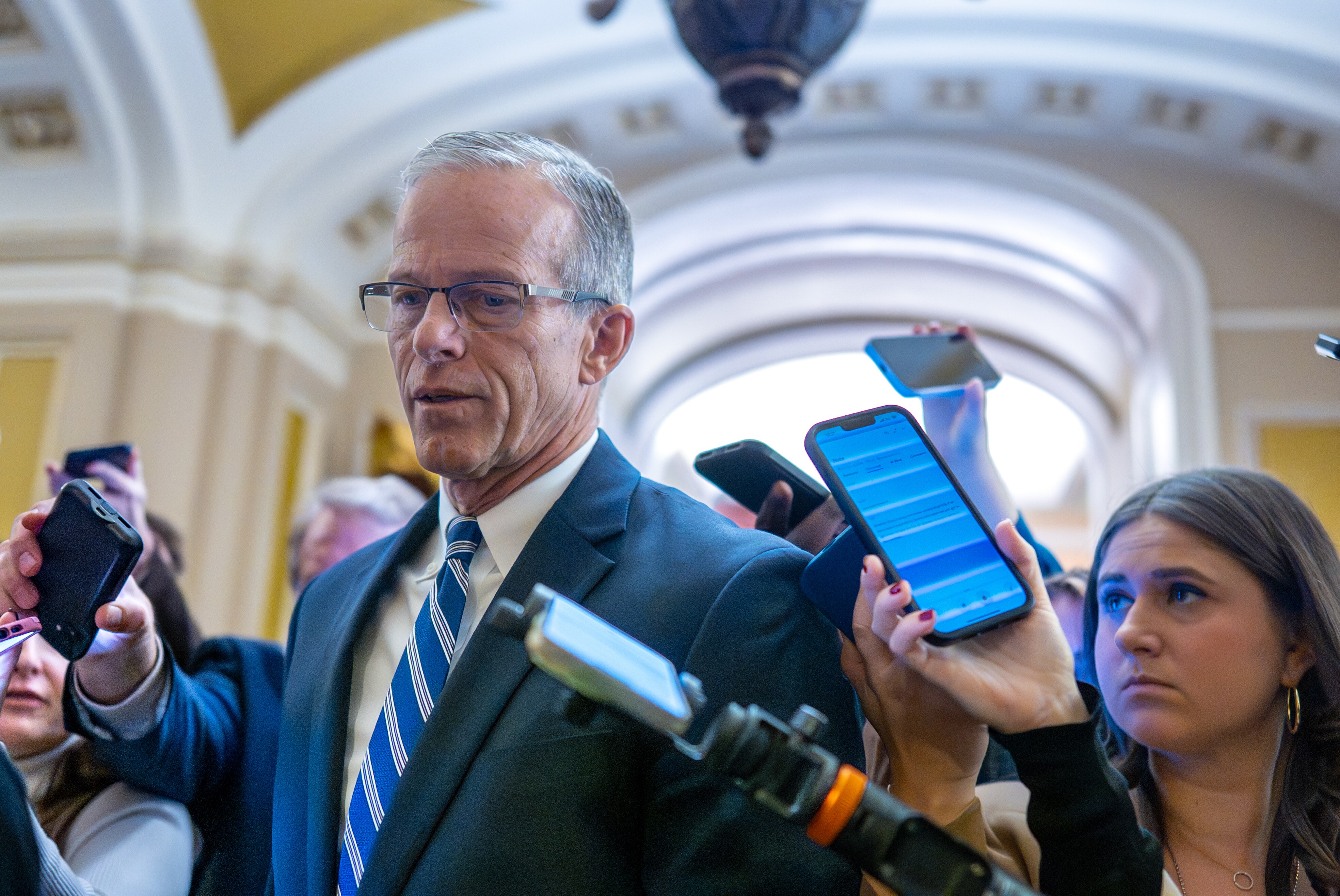 Senate Majority Leader John Thune, R-S.D., is surrounded by congressional reporters looking for updates on a plan to end the 38-day government shutdown, at the Capitol in Washington, Friday, Nov. 7, 2025. (AP Photo/J. Scott Applewhite)
