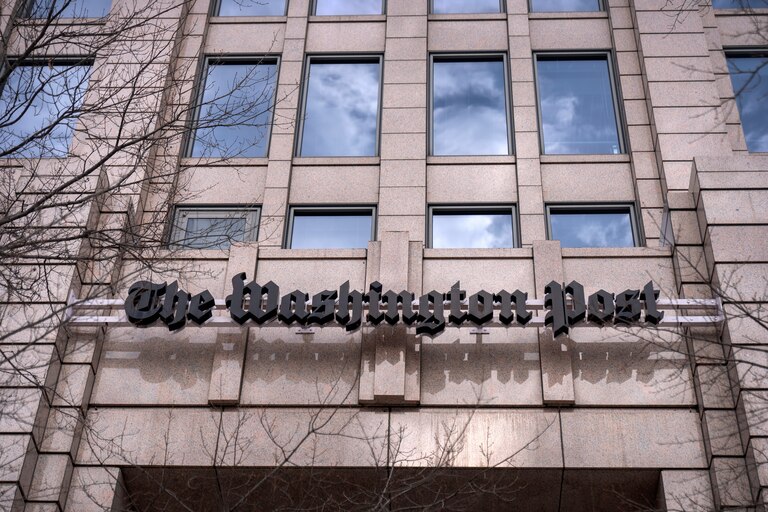 A sign for the Washington Post is seen at the company's offices in Washington.