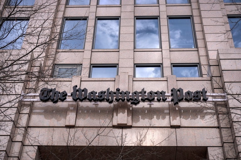 A sign for the Washington Post is seen at the company's offices in Washington.