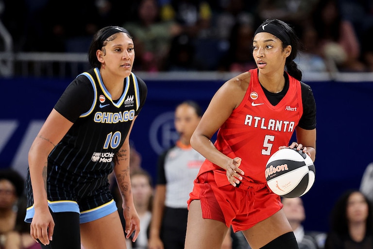 Angel Reese #5 of the Atlanta Dream is defended by Kamilla Cardoso #10 of the Chicago Sky during the second half.