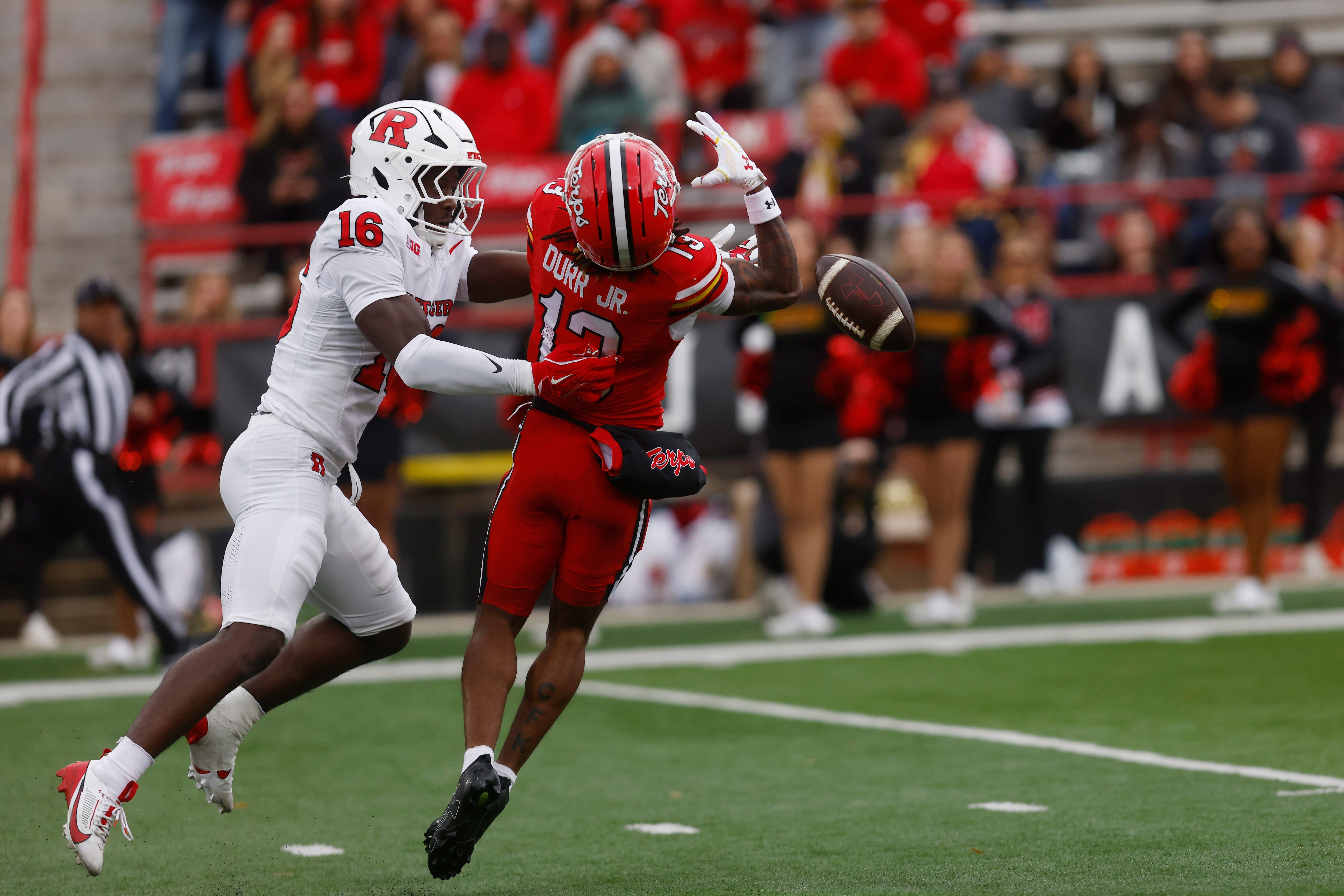 Maryland wide receiver Chris Durr Jr. (13) is unable to make a catch against Rutgers defensive back Jesse Ofurie (16) during the first half of an NCAA football game on Saturday, Oct. 17, 2026 in College Park, Md. (AP Photo/Mike Buscher)