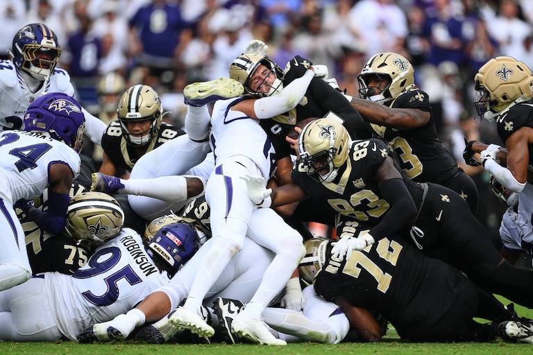 New Orleans Saints quarterback Tyler Shough converts on a fourth and one for a first down n the second half of an NFL football game in Baltimore, Sunday, Sept. 20, 2026. (AP Photo/Nick Wass)