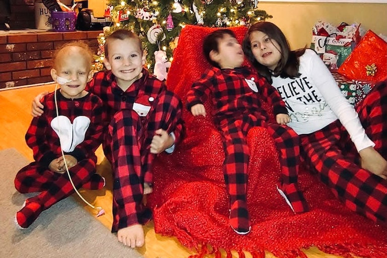 The four Hughan children on a recent Christmas.